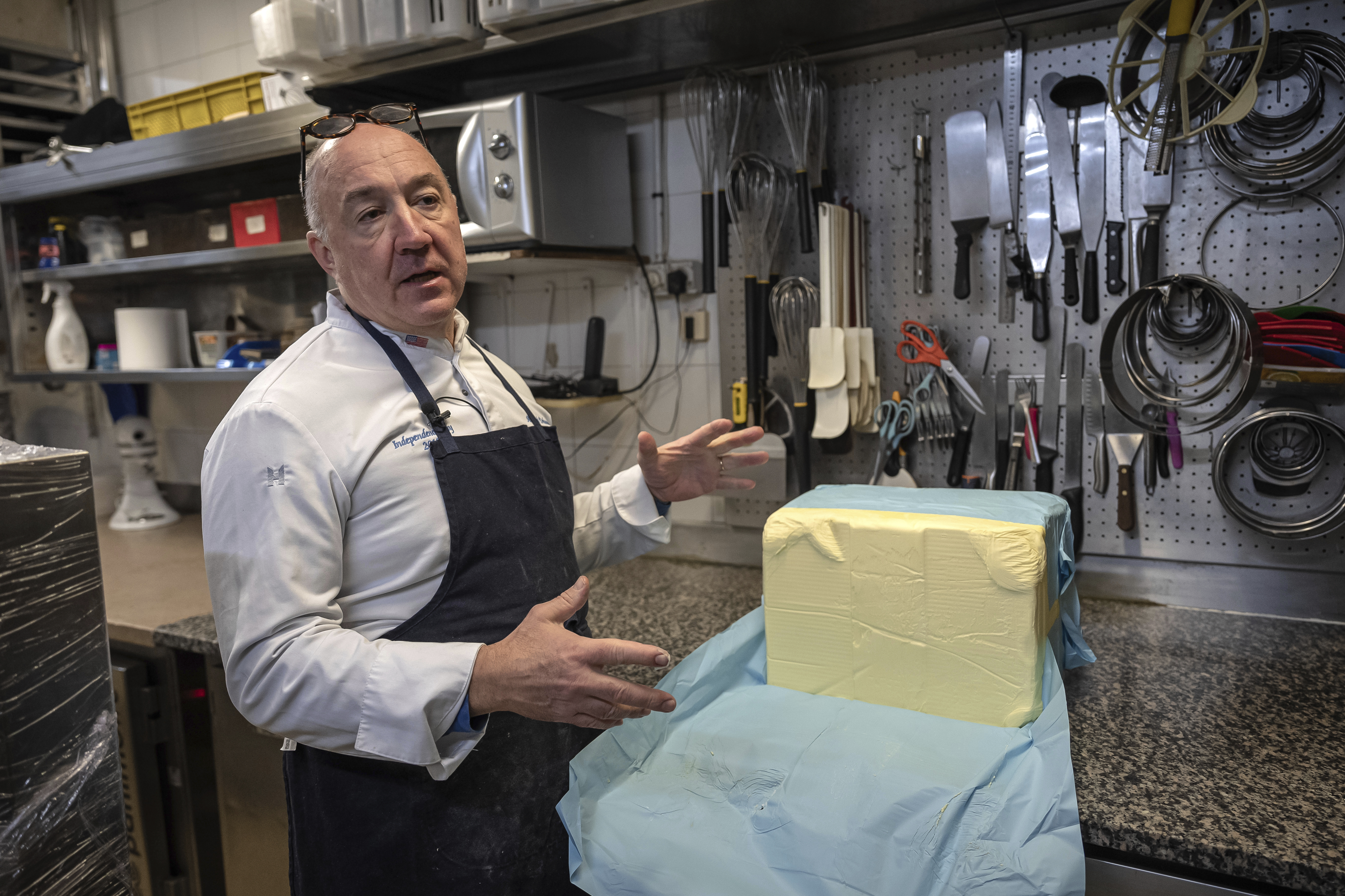 French baker Arnaud Delmontel talks about butter, its price and quality in his bakery in Paris, Monday, Dec. 16, 2024 as butter has shot up in price across Europe in recent months, adding more pain to consumers this holiday season after years of inflation in the wake of the COVID-19 pandemic and war in Ukraine.(AP Photo/Aurelien Morissard)