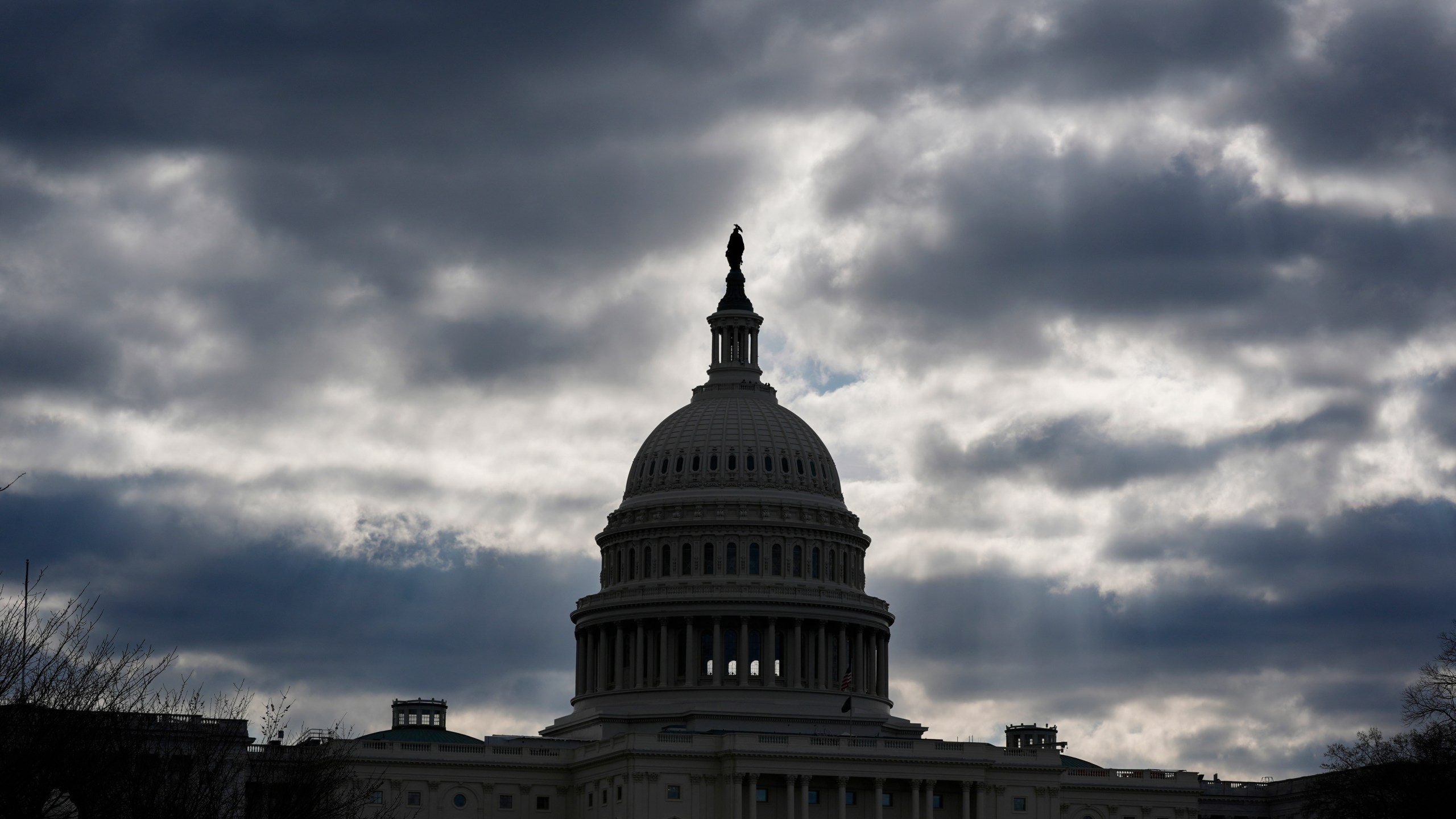 FILE - The Capitol in Washington, is framed by early morning clouds, March 19, 2024. Congress has until midnight Friday to come up with a way to fund the government, or federal agencies will shutter. It's up to each federal agency to determine how it handles a shutdown, but there would be disruptions in many services. (AP Photo/J. Scott Applewhite, File)