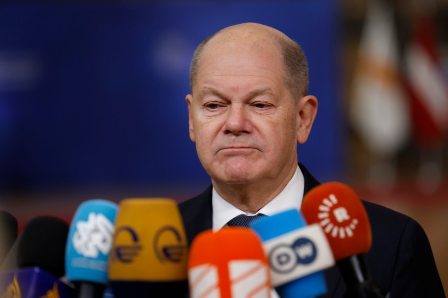 Germany's Chancellor Olaf Scholz speaks with the media as he arrives for an EU summit at the European Council building in Brussels, Thursday, Dec. 19, 2024. (AP Photo/Geert Vanden Wijngaert)