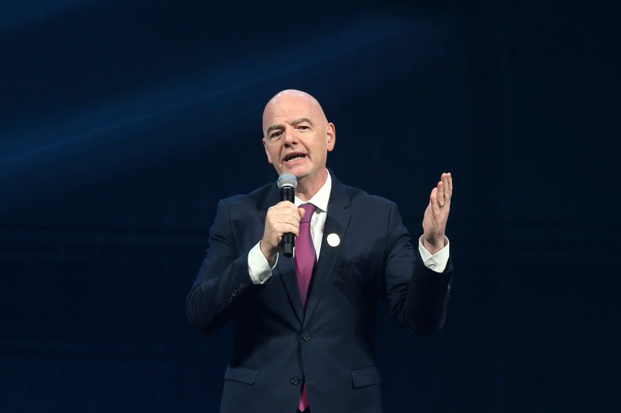 FIFA president Gianni Infantino delivers his speech before the FIFA Football Awards 2024 in Doha, Qatar, Tuesday, Dec. 17, 2024. (AP Photo/Hussein Sayed)