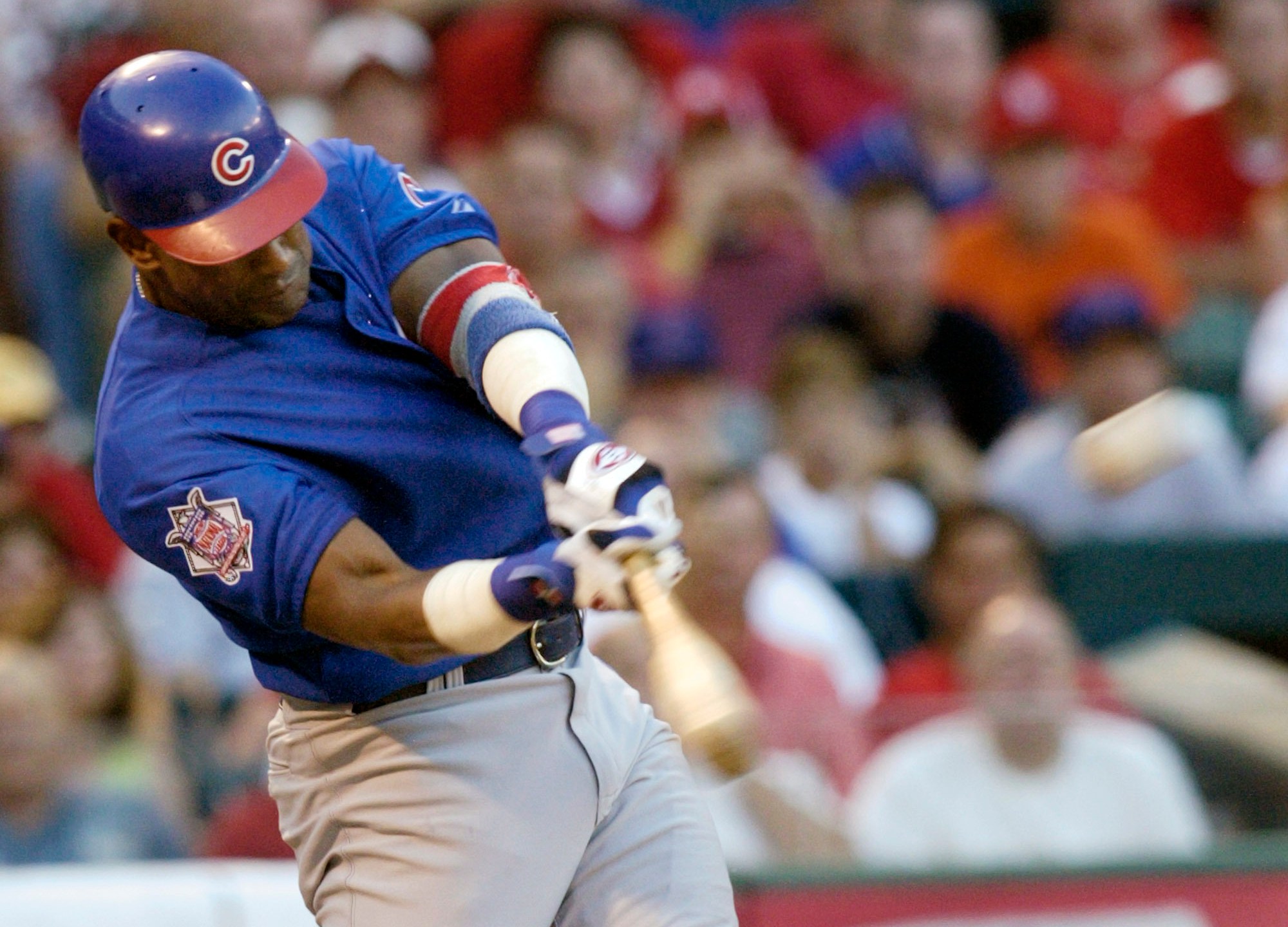 FILE - Chicago Cubs' Sammy Sosa connects for a three-run home run in the third ining against the St. Louis Cardinals Sunday, July 11, 2004 at Busch Stadium in St. Louis. (AP Photo/Tom Gannam, File)