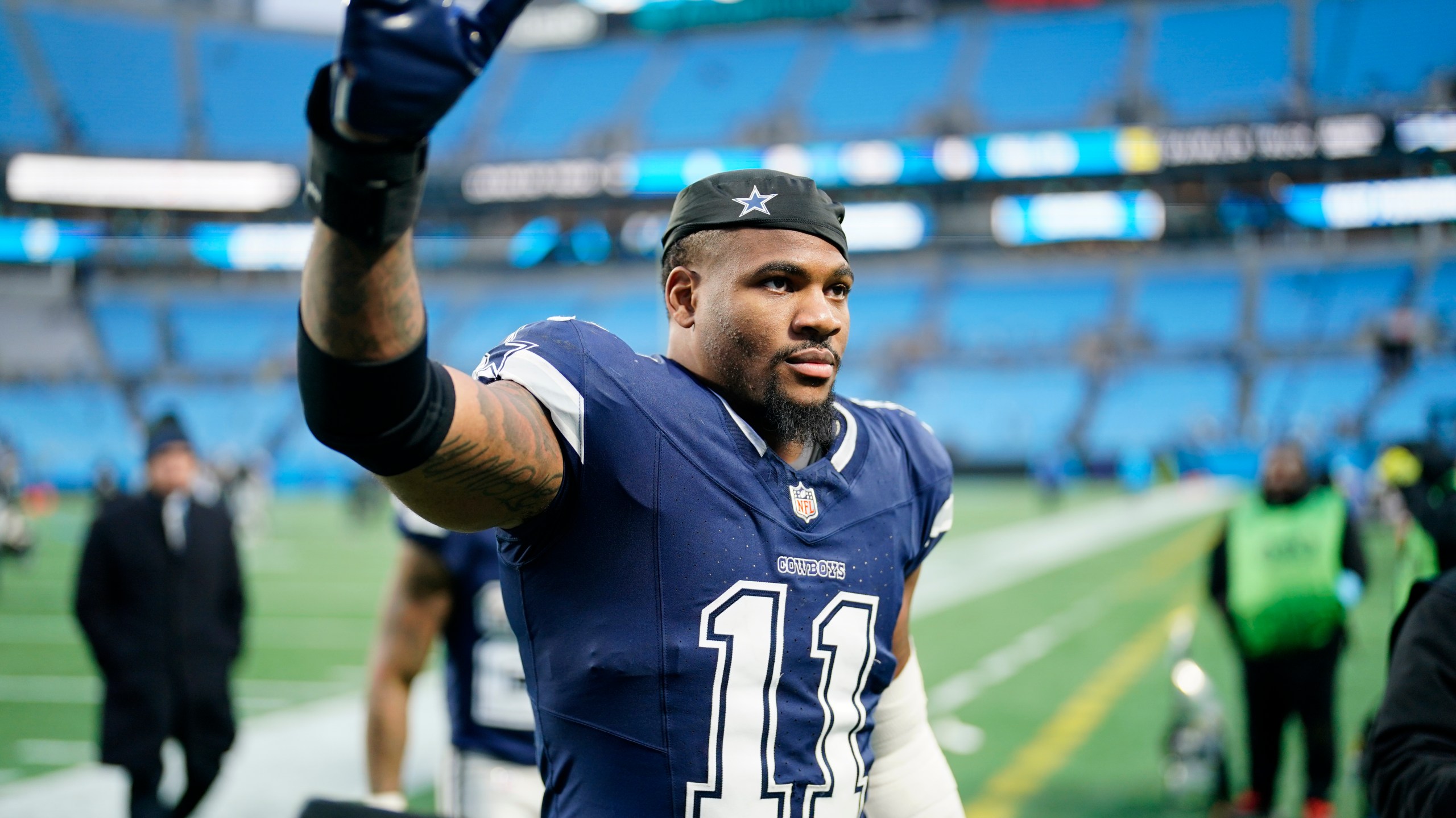 Dallas Cowboys linebacker Micah Parsons leaves the field after their win against the Carolina Panthers in an NFL football game, Sunday, Dec. 15, 2024, in Charlotte, N.C. (AP Photo/Jacob Kupferman)