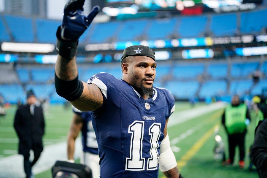 Dallas Cowboys linebacker Micah Parsons leaves the field after their win against the Carolina Panthers in an NFL football game, Sunday, Dec. 15, 2024, in Charlotte, N.C. (AP Photo/Jacob Kupferman)