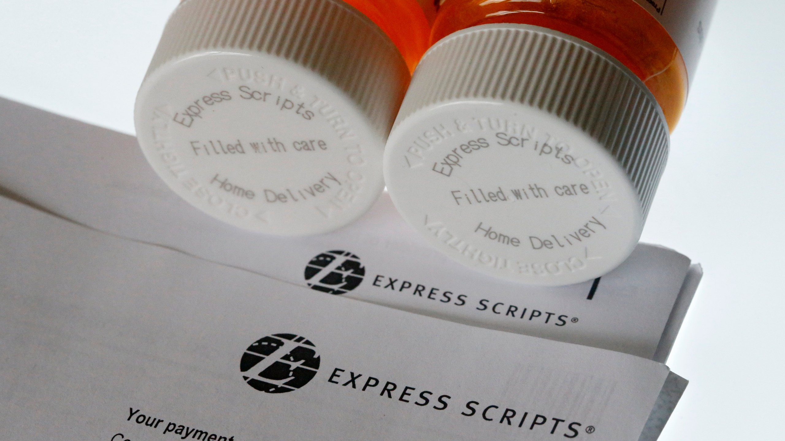 FILE - In this Tuesday, July 25, 2017, file photo, Express Scripts prescription medication bottles are arranged for a photo, in Surfside, Fla. (AP Photo/Wilfredo Lee, File)