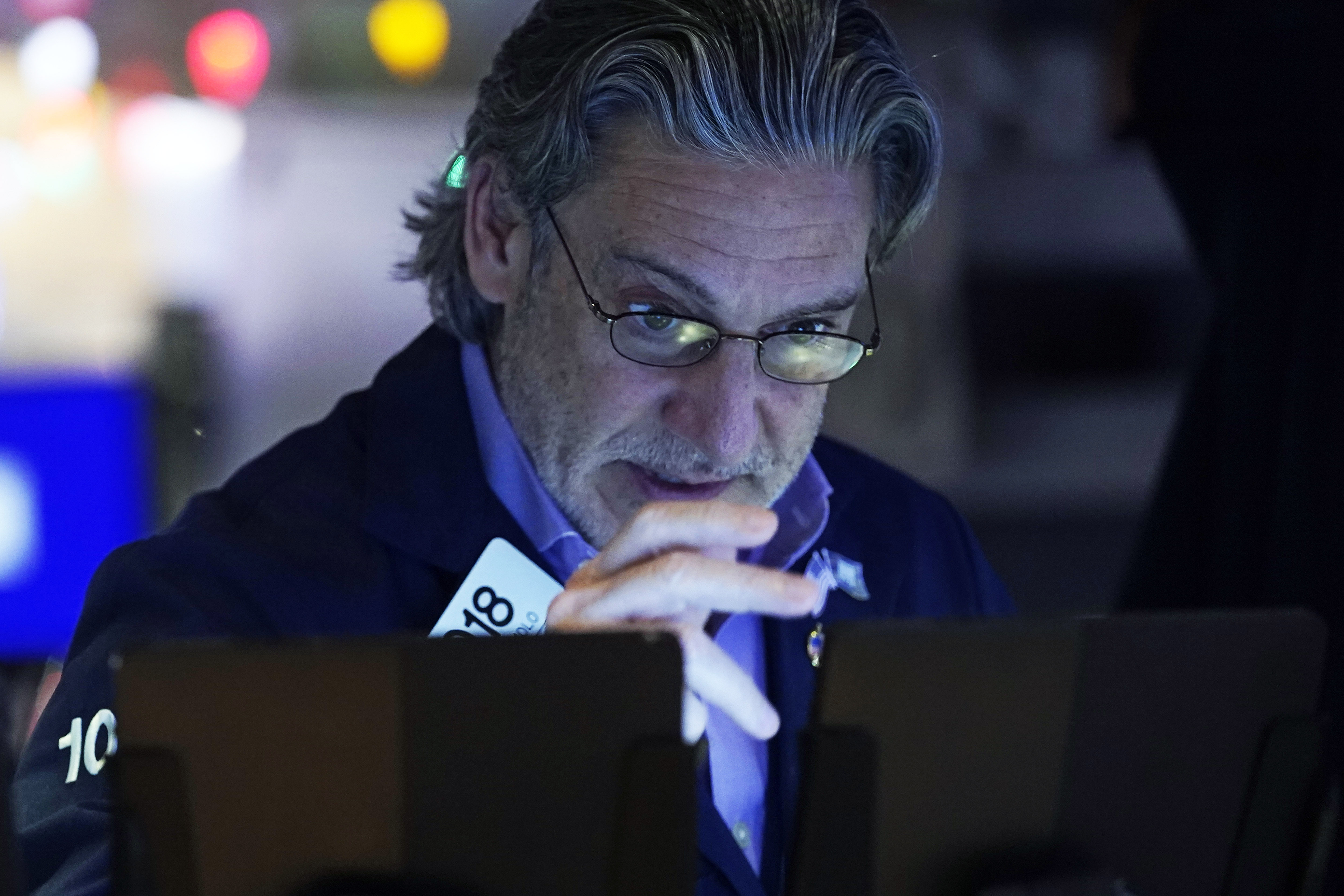 Trader John Romolo works on the floor of the New York Stock Exchange, Wednesday, Dec. 18, 2024. (AP Photo/Richard Drew)