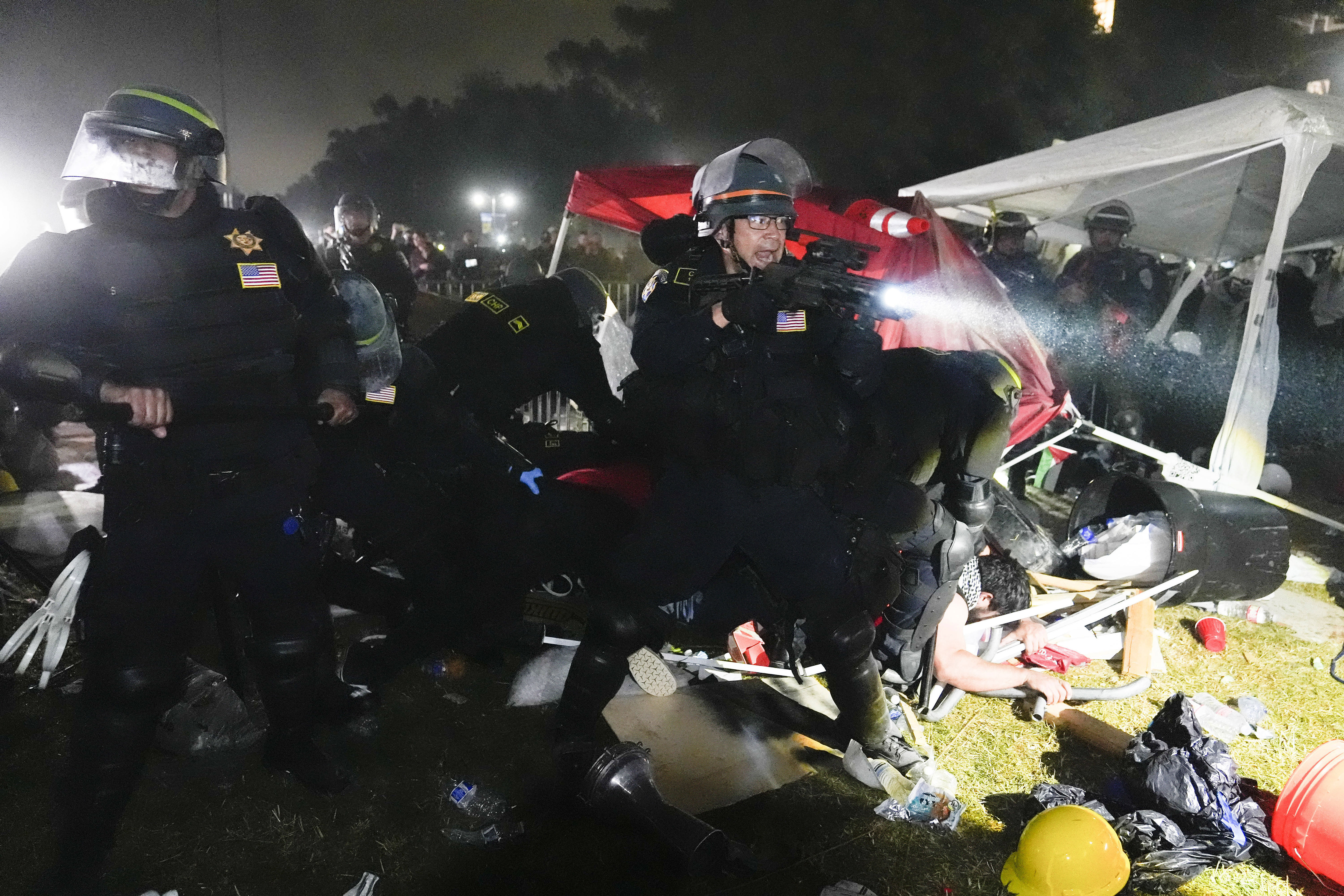 FILE - Police advance on pro-Palestinian demonstrators after defying orders to leave at an encampment on the UCLA campus, in Los Angeles, May 2, 2024. (AP Photo/Jae C. Hong, File)