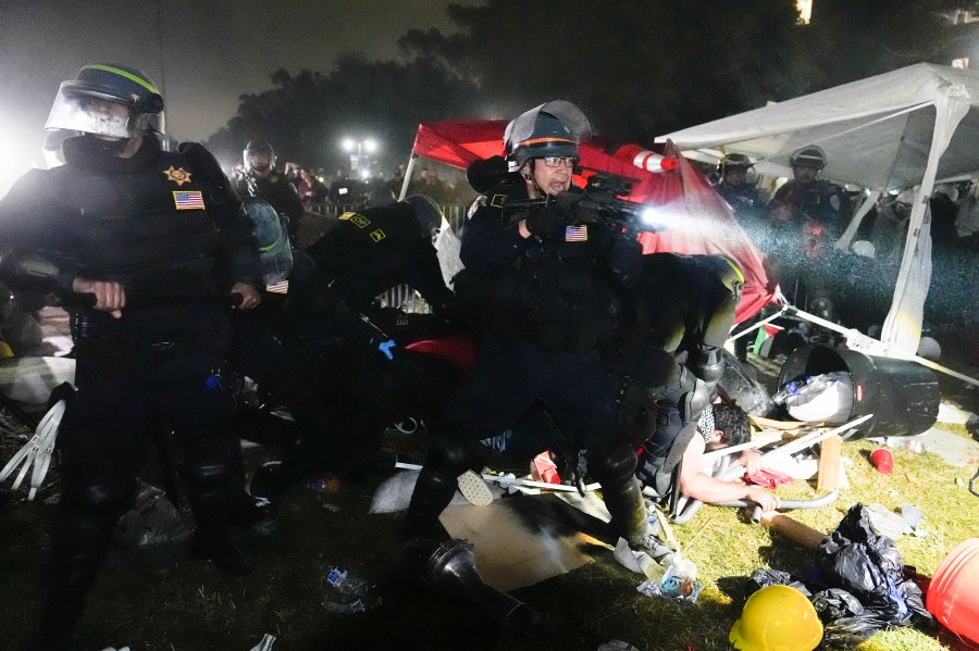 FILE - Police advance on pro-Palestinian demonstrators after defying orders to leave at an encampment on the UCLA campus, in Los Angeles, May 2, 2024. (AP Photo/Jae C. Hong, File)