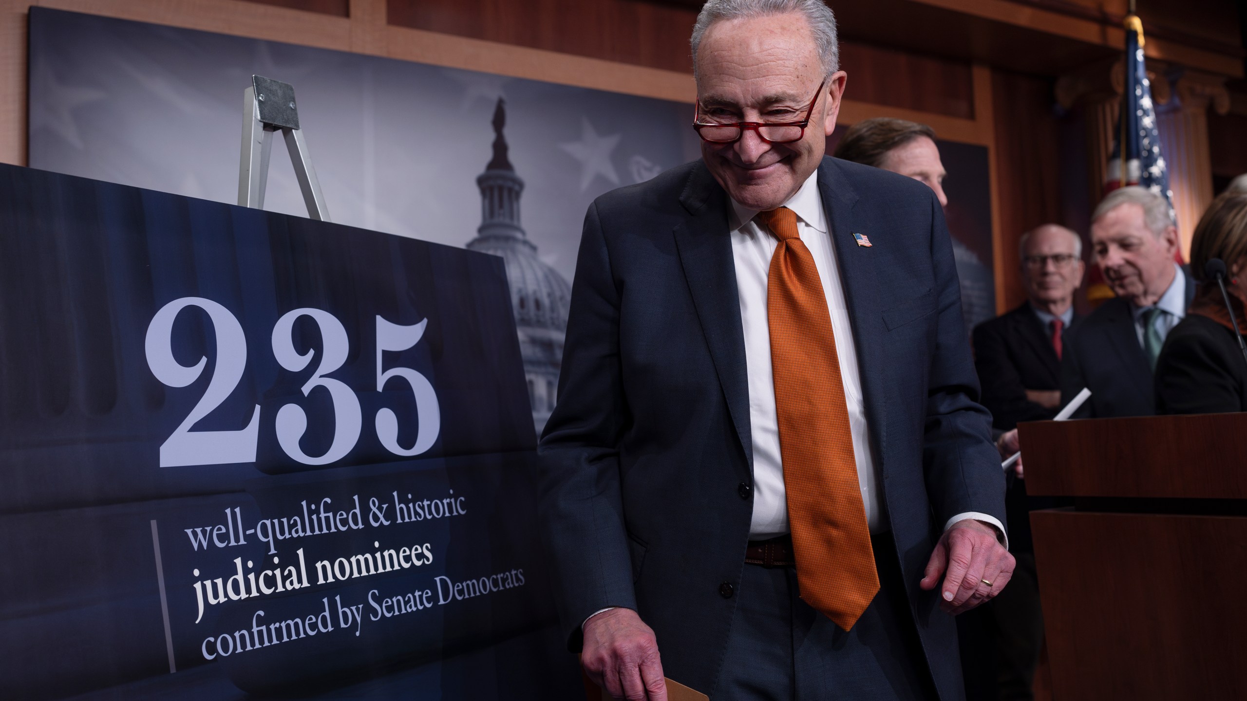 Senate Majority Leader Chuck Schumer, D-N.Y., and members of the Senate Judiciary Committee, meet with reporters to mark the confirmation of 235 federal judges nominated by President Joe Biden during the 118th Congress, at the Capitol in Washington, Friday, Dec. 20, 2024. (AP Photo/J. Scott Applewhite)