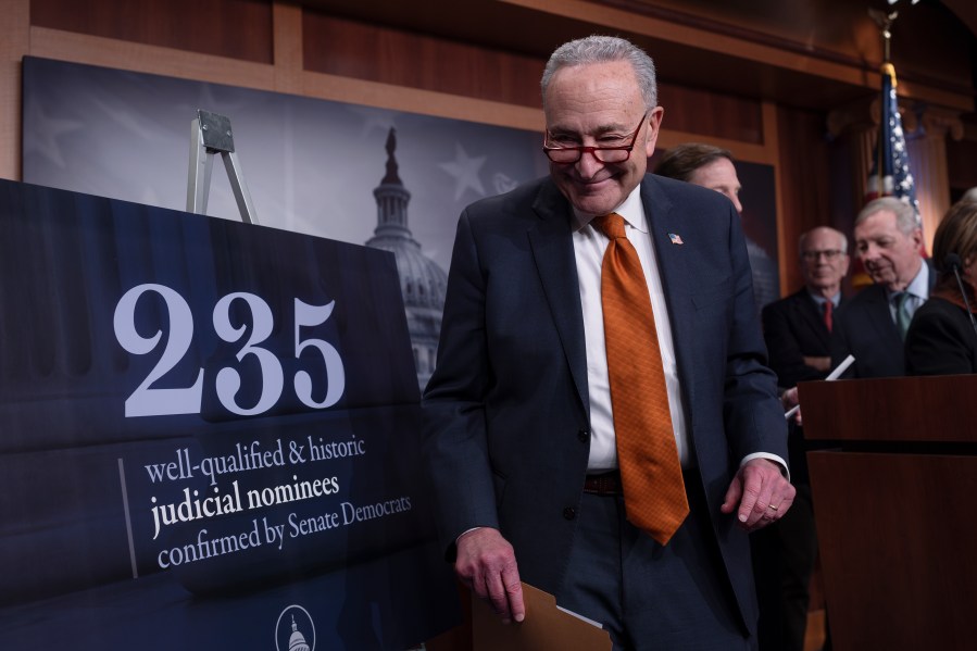 Senate Majority Leader Chuck Schumer, D-N.Y., and members of the Senate Judiciary Committee, meet with reporters to mark the confirmation of 235 federal judges nominated by President Joe Biden during the 118th Congress, at the Capitol in Washington, Friday, Dec. 20, 2024. (AP Photo/J. Scott Applewhite)