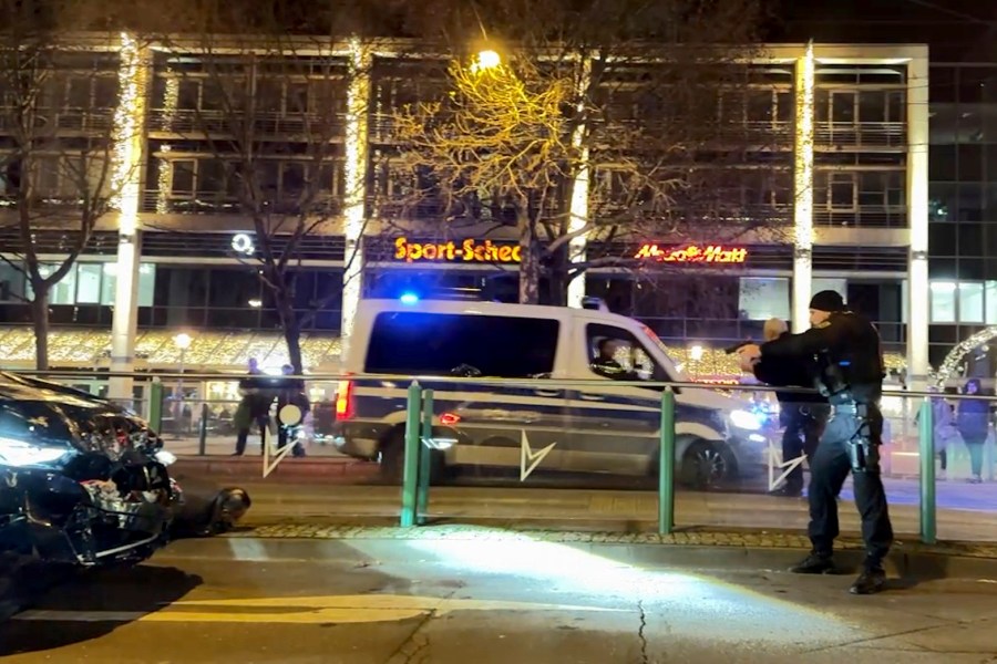 An image taken from a video shows police officers arresting a suspect after car drove into a crowd at the Christmas market in Magdeburg, Germany, Friday Dec. 20, 2024. (TNN/DPA via AP)