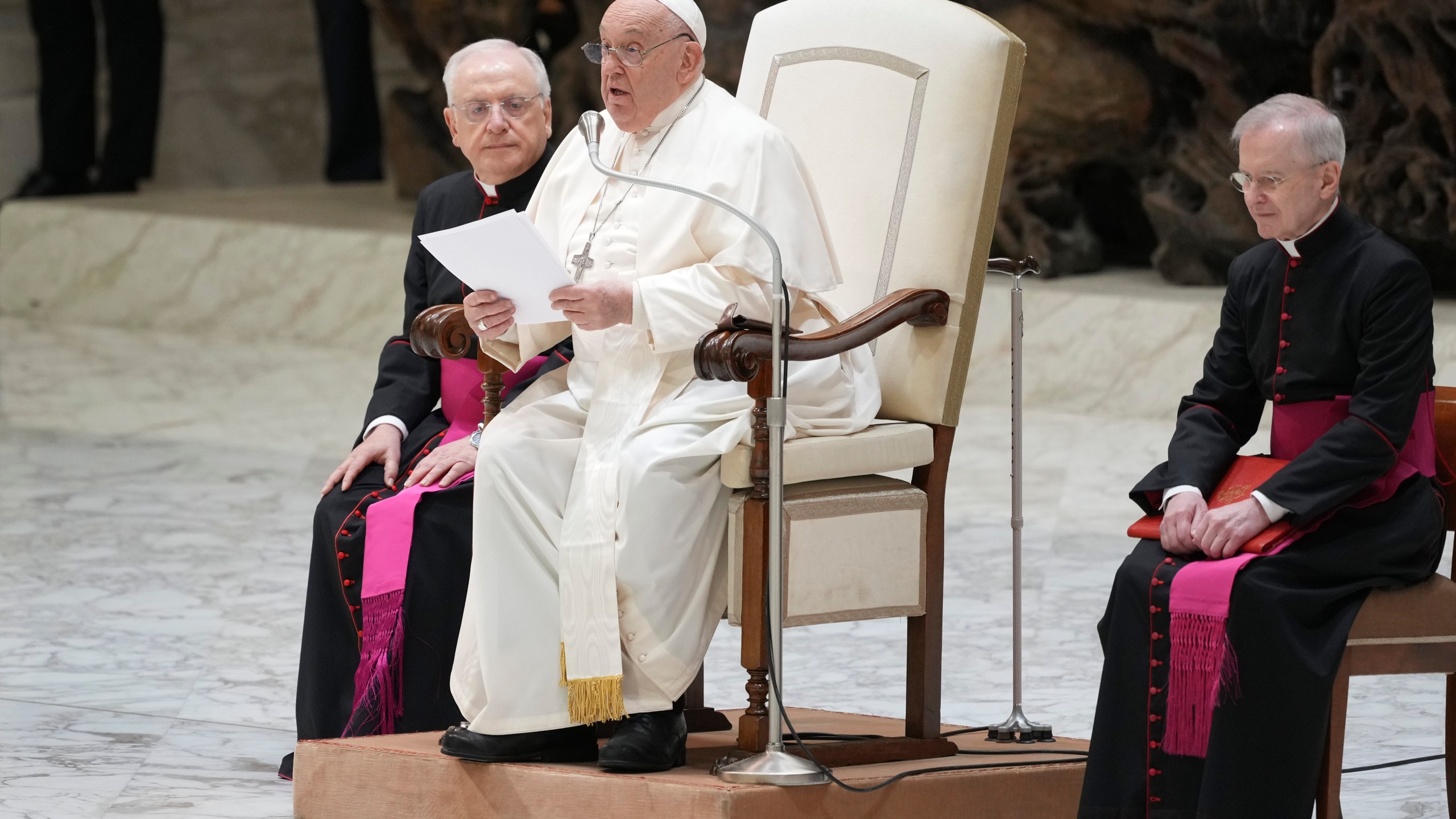 Pope Francis exchanges the season's greetings with Vatican employees, in the Paul VI Hall at the Vatican, Saturday, Dec. 21, 2024. (AP Photo/Andrew Medichini)