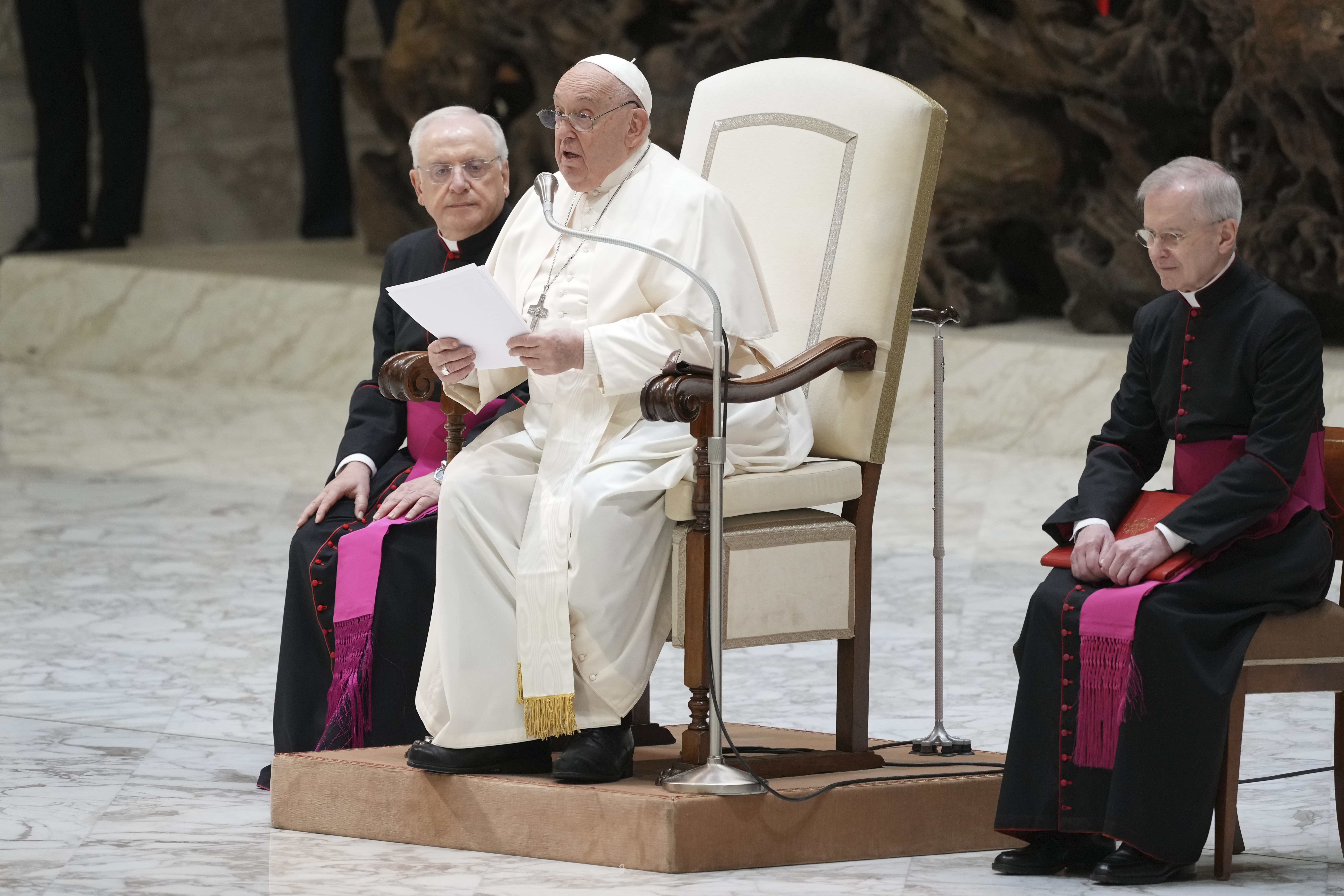 Pope Francis exchanges the season's greetings with Vatican employees, in the Paul VI Hall at the Vatican, Saturday, Dec. 21, 2024. (AP Photo/Andrew Medichini)