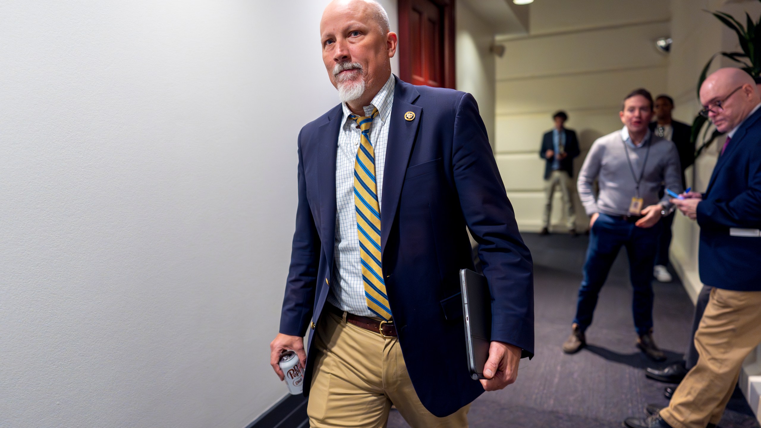 Rep. Chip Roy, R-Texas, leaves a Republican meeting where House Speaker Mike Johnson is proposing a new plan that would temporarily fund federal operations and disaster aid at the Capitol in Washington, Friday, Dec. 20, 2024. (AP Photo/J. Scott Applewhite)