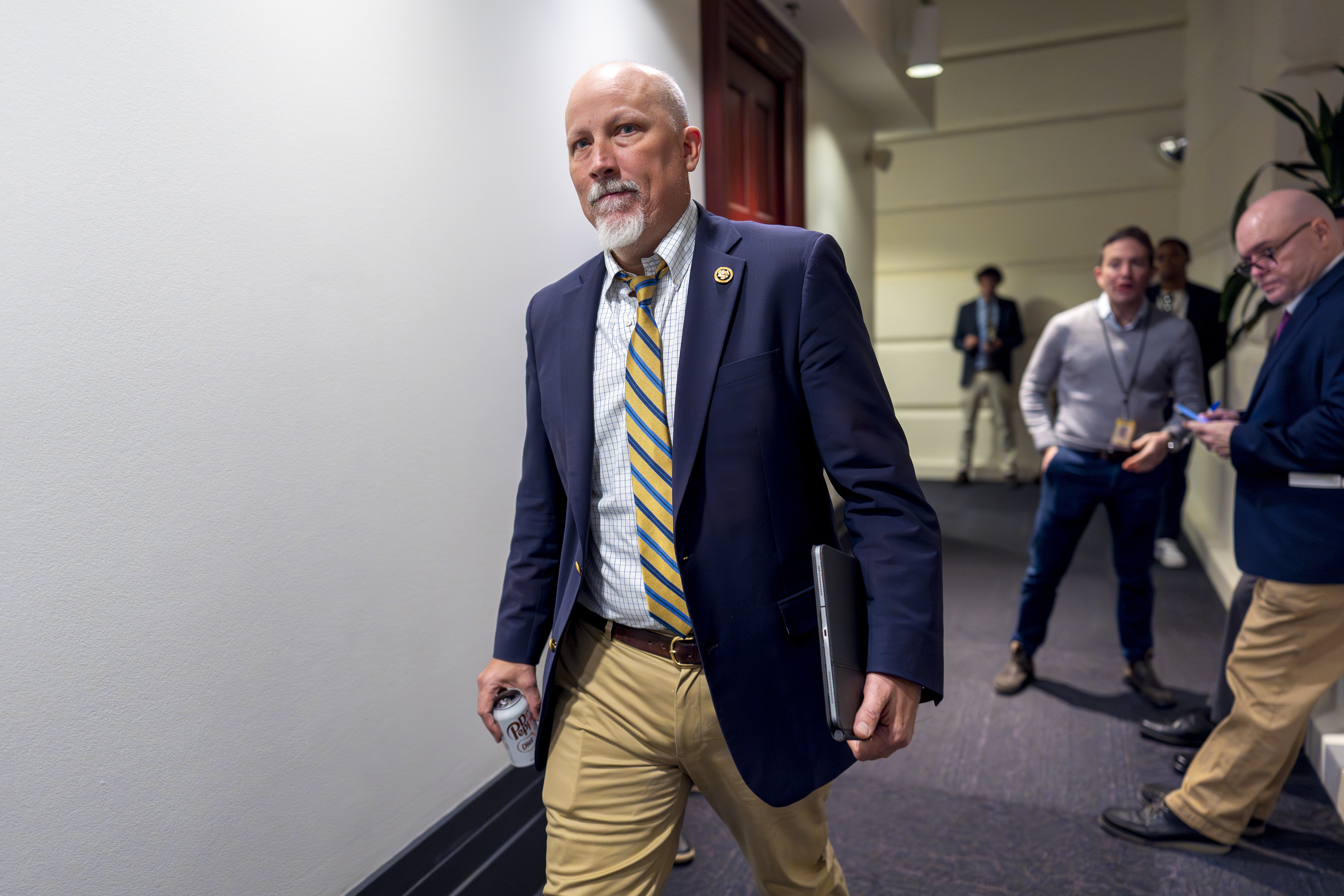 Rep. Chip Roy, R-Texas, leaves a Republican meeting where House Speaker Mike Johnson is proposing a new plan that would temporarily fund federal operations and disaster aid at the Capitol in Washington, Friday, Dec. 20, 2024. (AP Photo/J. Scott Applewhite)