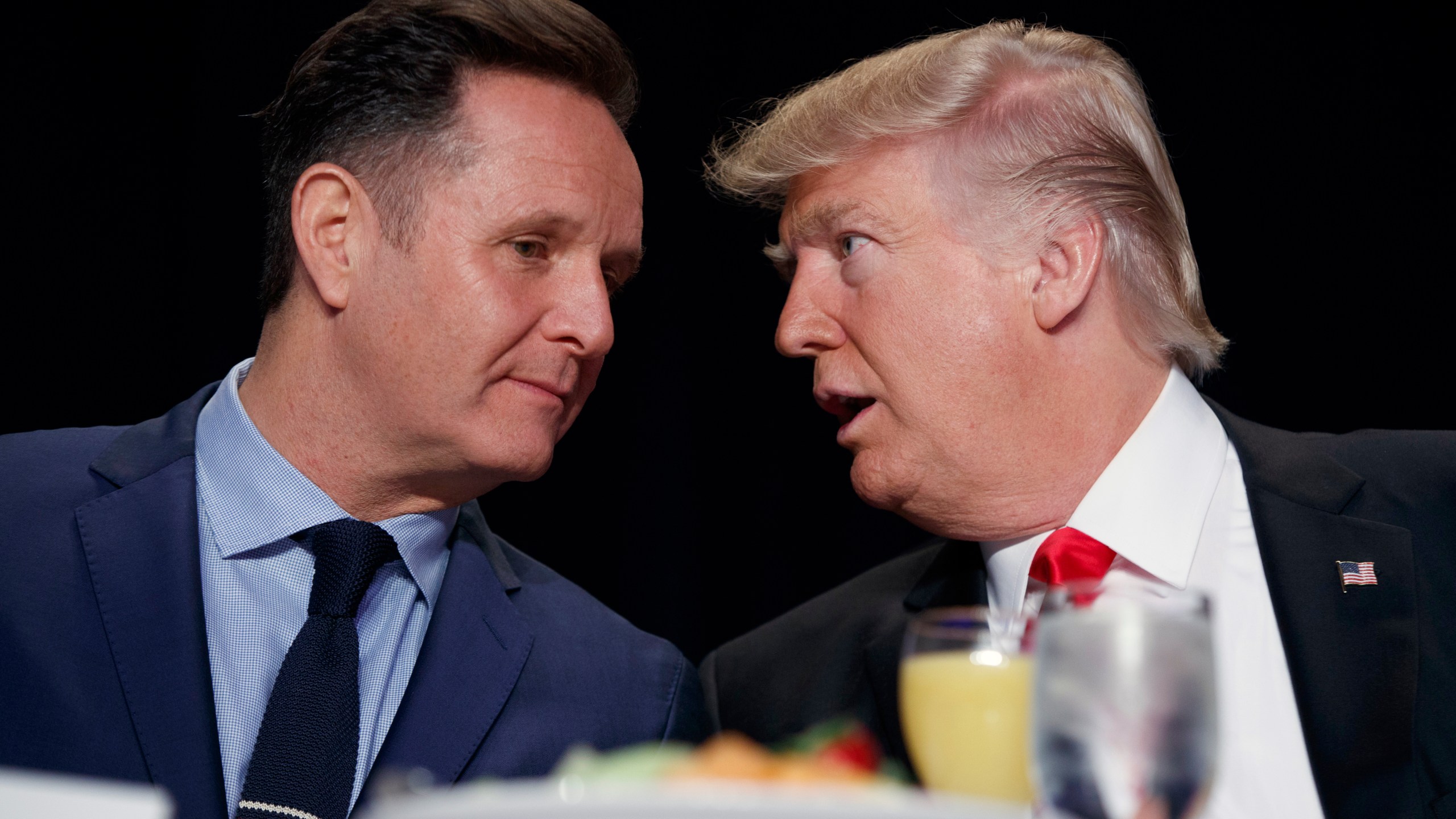 FILE - President Donald Trump, right, talks with television producer Mark Burnett during the National Prayer Breakfast, Feb. 2, 2017, in Washington. (AP Photo/Evan Vucci, File)