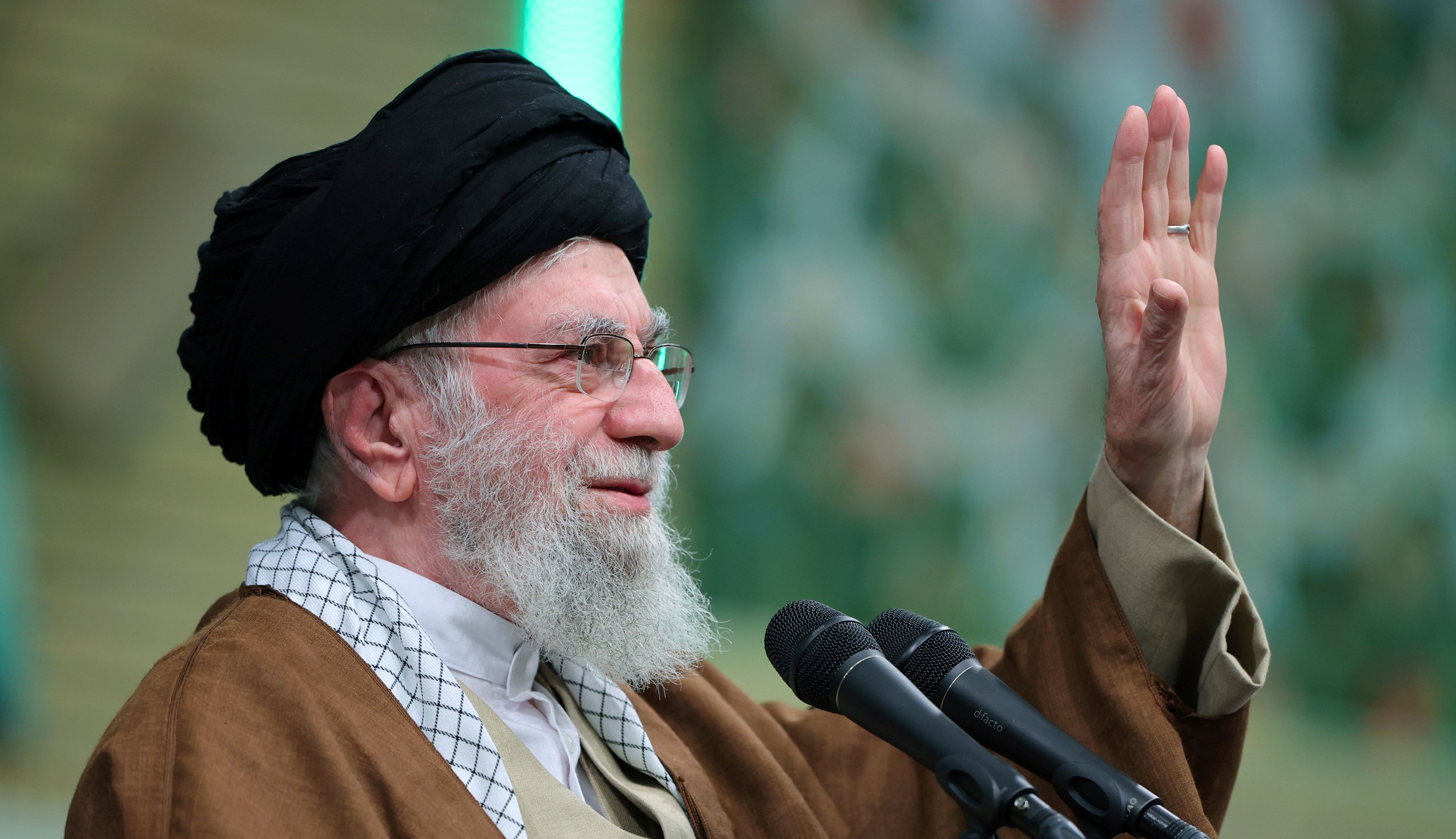 In this photo released by an official website of the office of the Iranian supreme leader, Supreme Leader Ayatollah Ali Khamenei waves to the crowd during a meeting in Tehran, Iran, Sunday, Dec. 22, 2024. (Office of the Iranian Supreme Leader via AP)