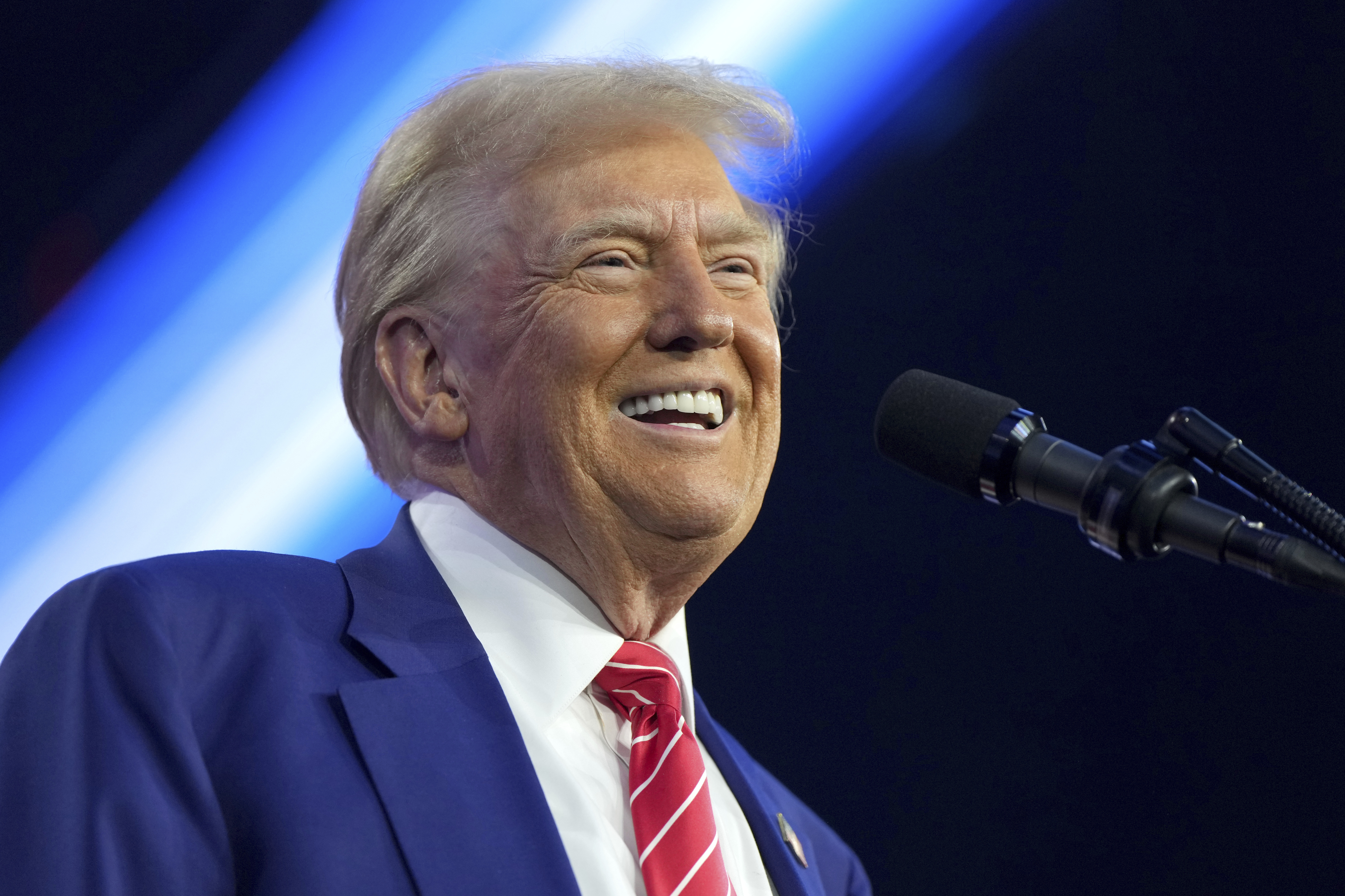 President-elect Donald Trump speaks at AmericaFest, Sunday, Dec. 22, 2024, in Phoenix. (AP Photo/Rick Scuteri)