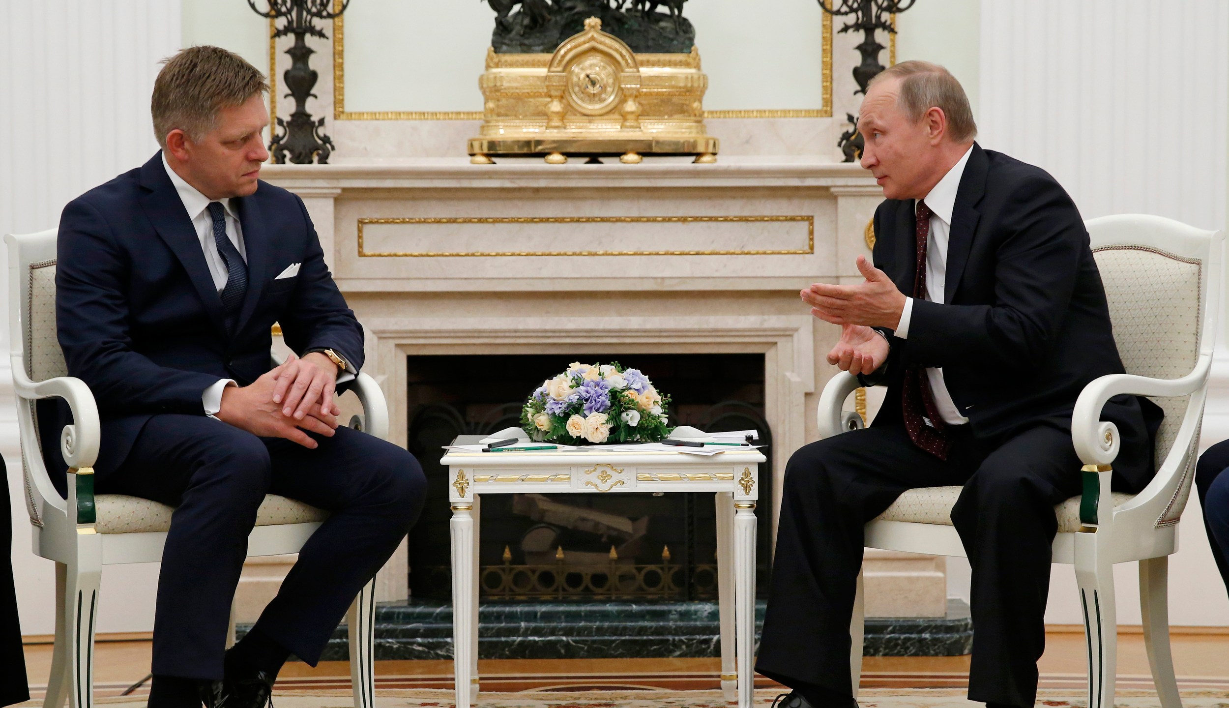 FILE - Russian President Vladimir Putin, right, speaks to Slovak Prime Minister Robert Fico during their meeting in the Kremlin in Moscow, Russia, Thursday, Aug. 25, 2016. (AP Photo/Alexander Zemlianichenko, pool, File)