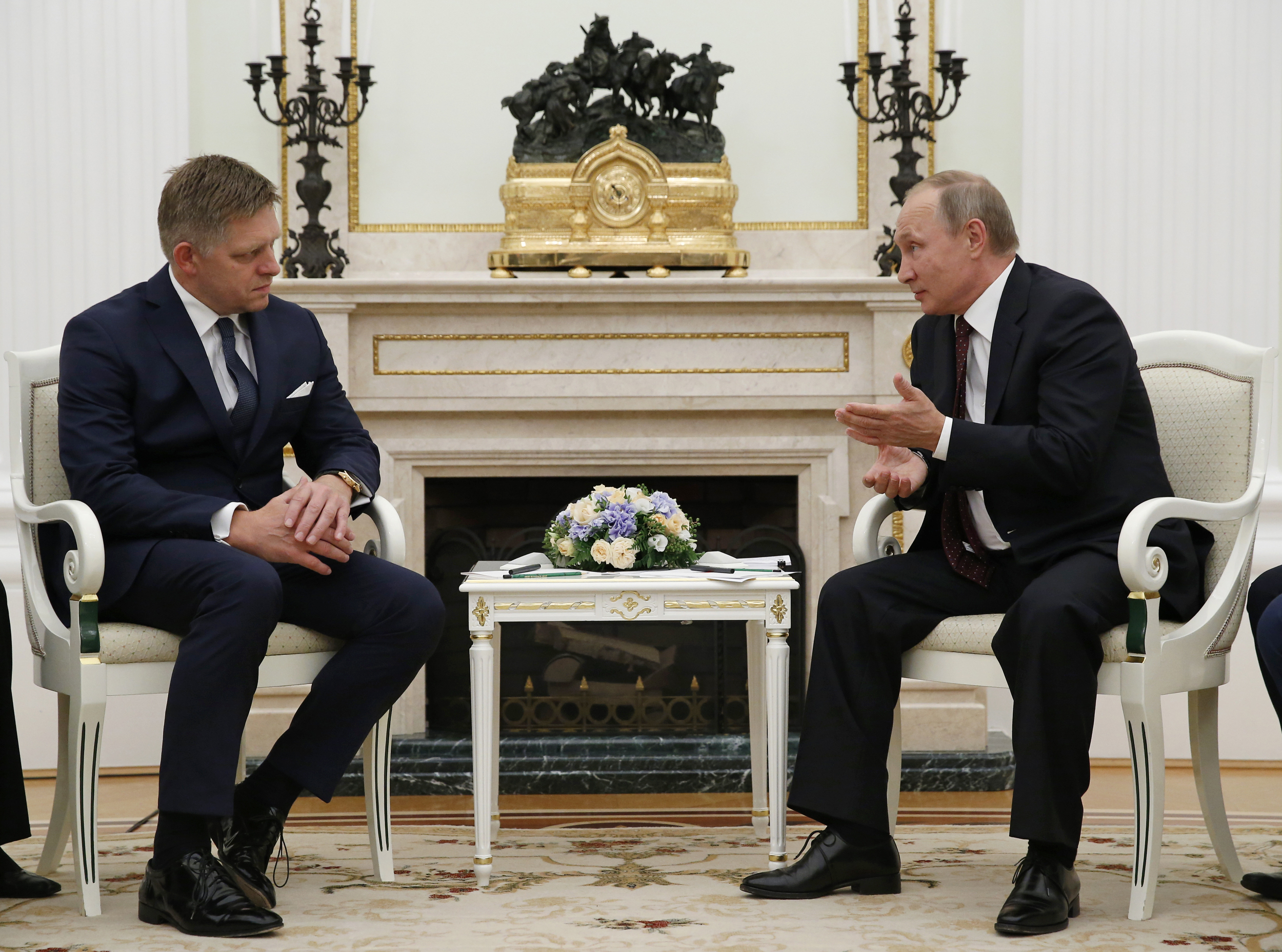 FILE - Russian President Vladimir Putin, right, speaks to Slovak Prime Minister Robert Fico during their meeting in the Kremlin in Moscow, Russia, Thursday, Aug. 25, 2016. (AP Photo/Alexander Zemlianichenko, pool, File)