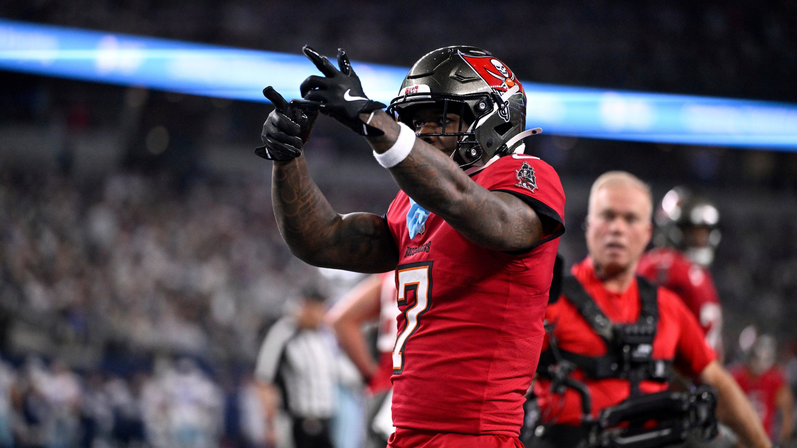 Tampa Bay Buccaneers running back Bucky Irving celebrates after rushing for a touchdown against th eDallas Cowboys in the first half of an NFL football game in Arlington, Texas, Sunday, Dec. 22, 2024. (AP Photo/Jerome Miron)