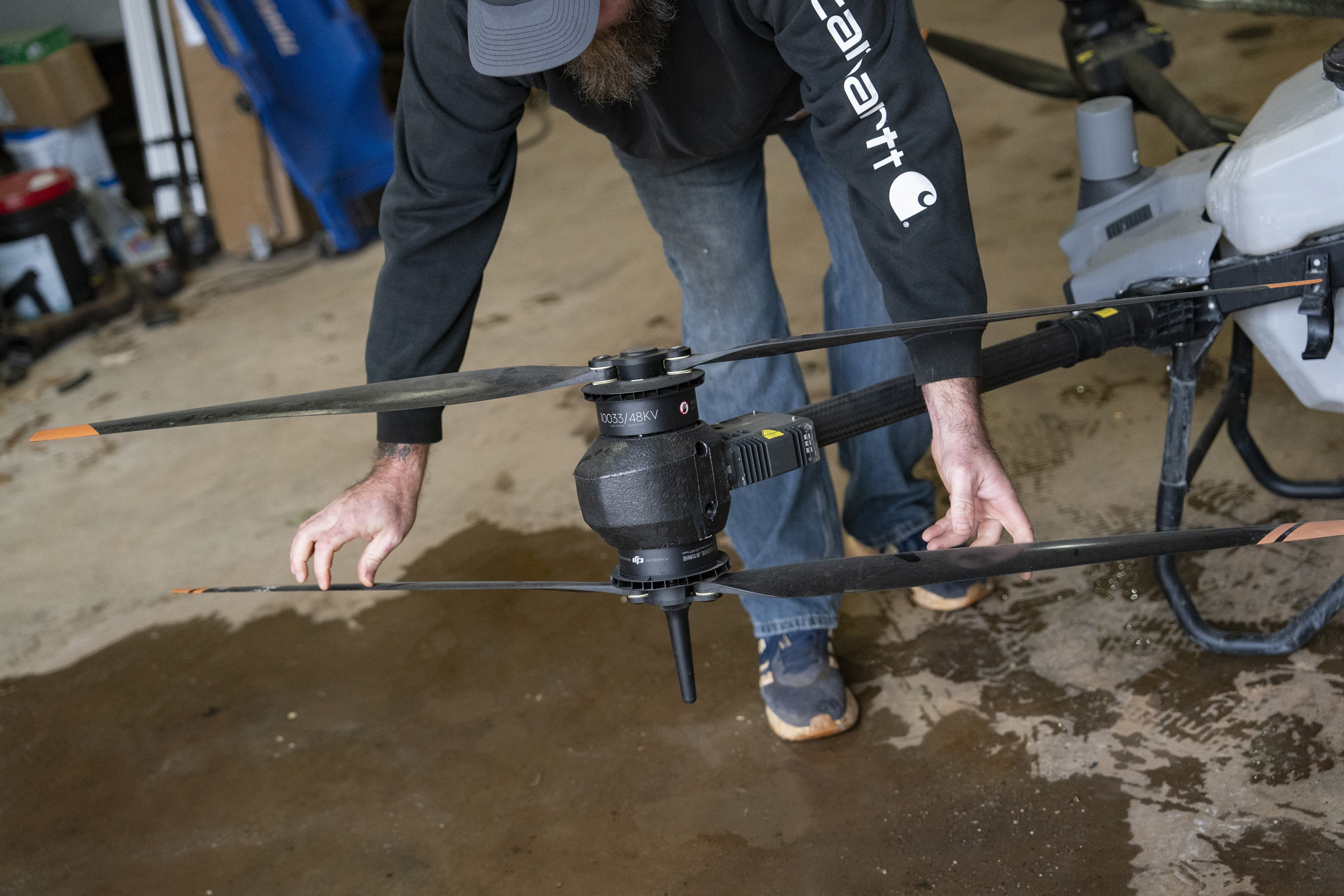 Russell Hedrick prepares a DJI drone to put crop cover on his farm, Tuesday, Dec. 17, 2024, in Hickory, N.C. (AP Photo/Allison Joyce)