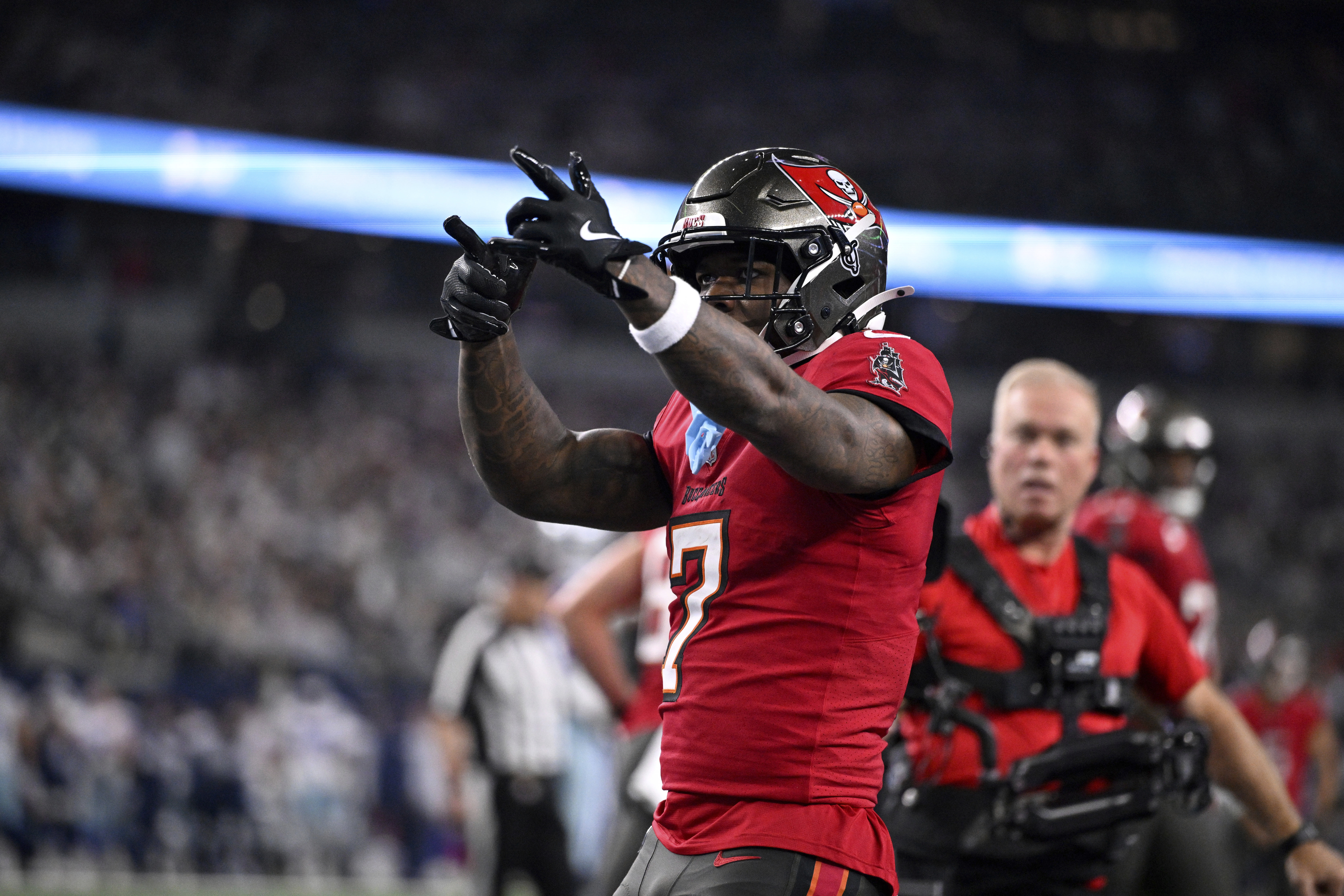 Tampa Bay Buccaneers running back Bucky Irving celebrates after rushing for a touchdown against th eDallas Cowboys in the first half of an NFL football game in Arlington, Texas, Sunday, Dec. 22, 2024. (AP Photo/Jerome Miron)