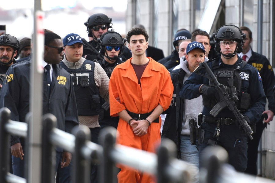 Luigi Mangione, charged with the fatal shooting of UnitedHealthcare CEO Brian Thompson, is escorted by police in New York, Dec. 19, 2024. (AP Photo/Pamela Smith)