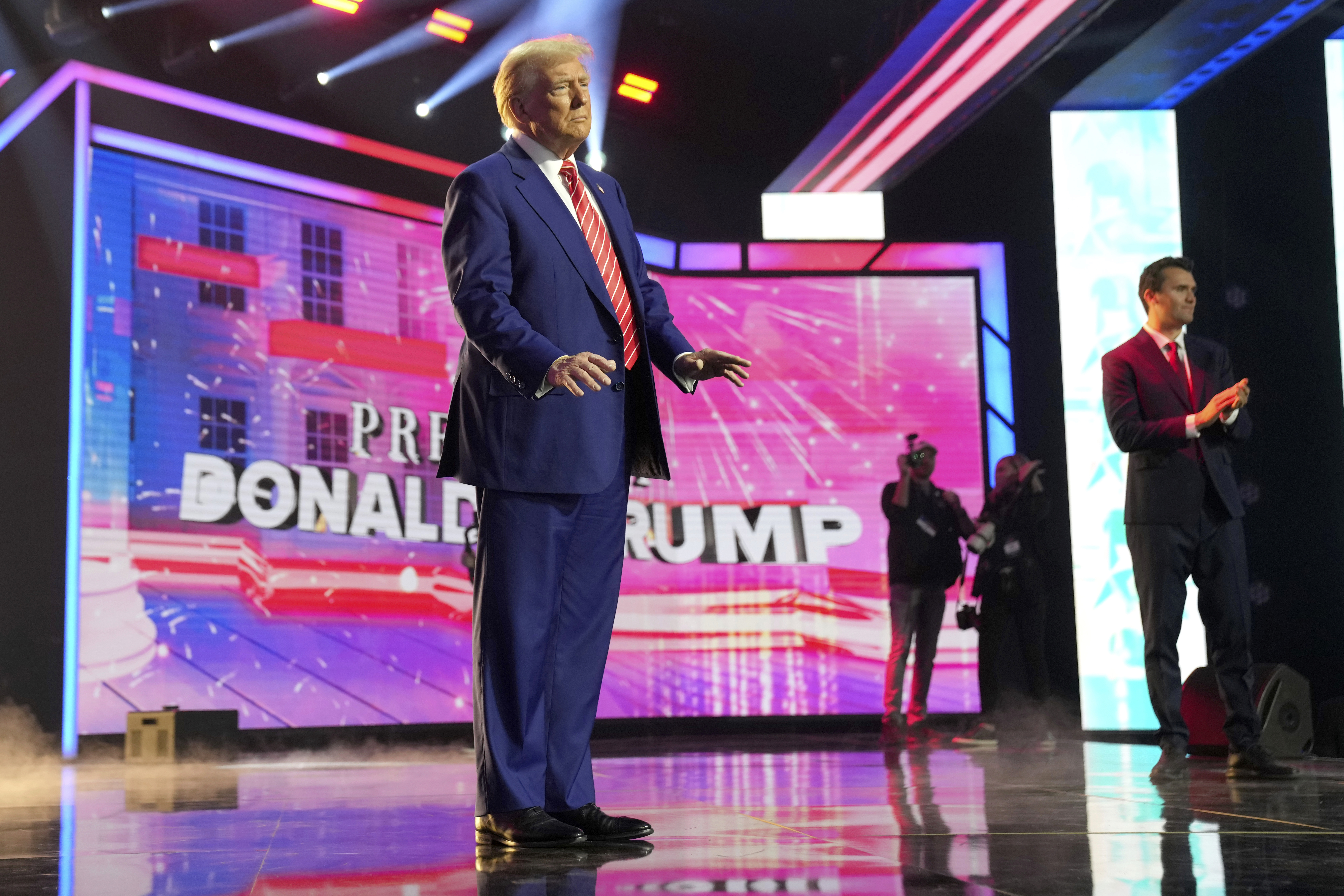 President-elect Donald Trump arrives to speak at AmericaFest, Sunday, Dec. 22, 2024, in Phoenix. (AP Photo/Rick Scuteri)