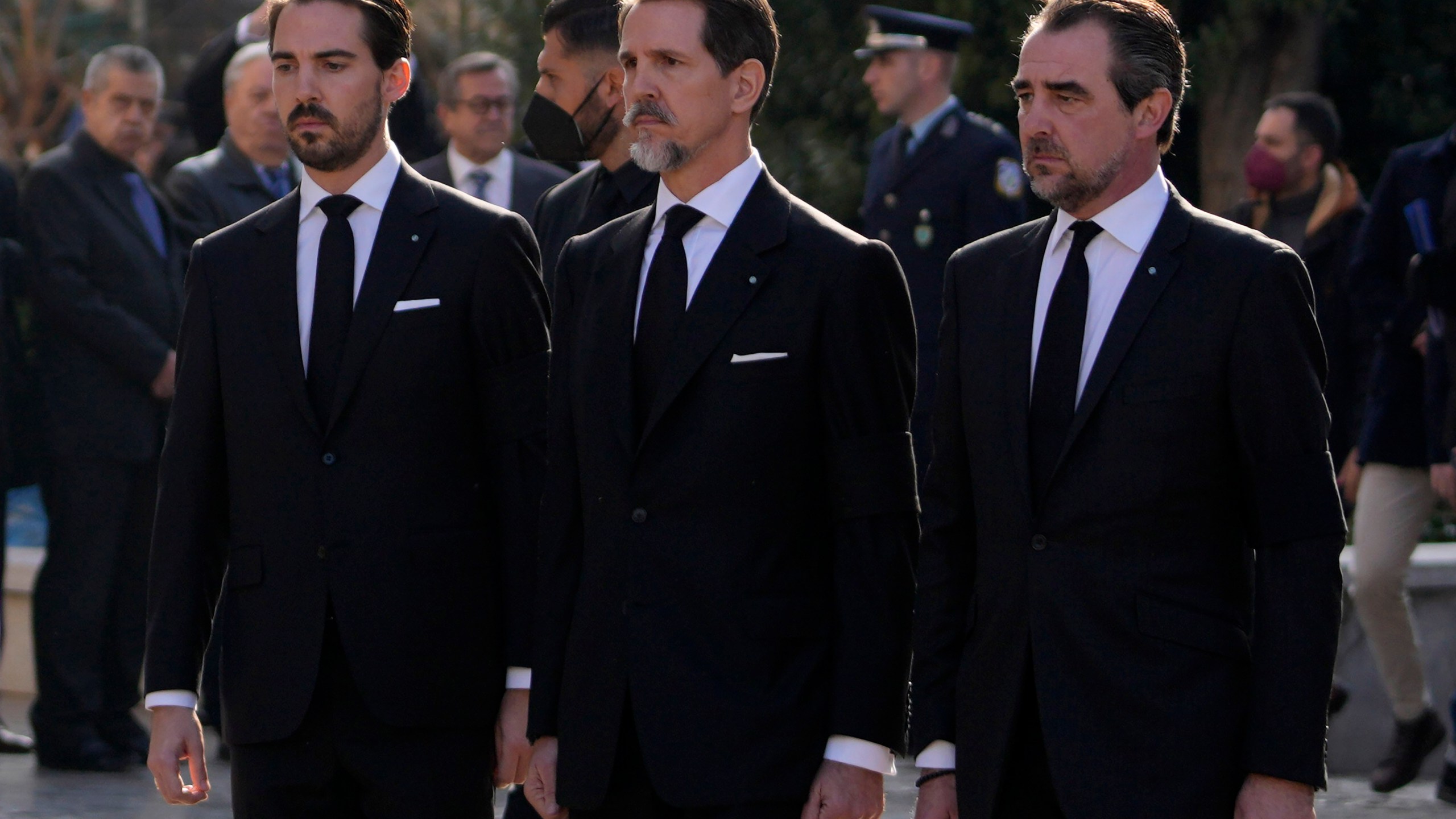 FILE - Prince Philippos, left, Prince Pavlos, center, and Prince Nikolaos, right, sons of former king of Greece Constantine II stand behind their father coffin as they arrive at the Metropolitan cathedral for his funeral in Athens, Monday, Jan. 16, 2023. (AP Photo/Petros Giannakouris, File)