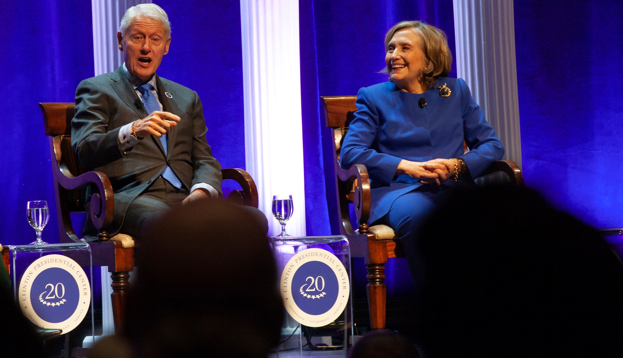 Former President Bill Clinton and former Secretary of State Hillary Rodham Clinton respond to audience questions on Saturday, Dec. 7, 2024 at the Robinson Center auditorum in Little Rock, Ark. (AP Photo/Katie Adkins)