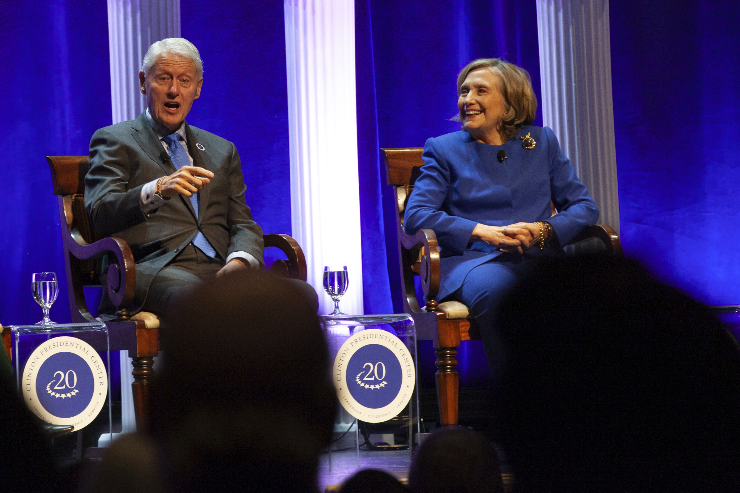 Former President Bill Clinton and former Secretary of State Hillary Rodham Clinton respond to audience questions on Saturday, Dec. 7, 2024 at the Robinson Center auditorum in Little Rock, Ark. (AP Photo/Katie Adkins)