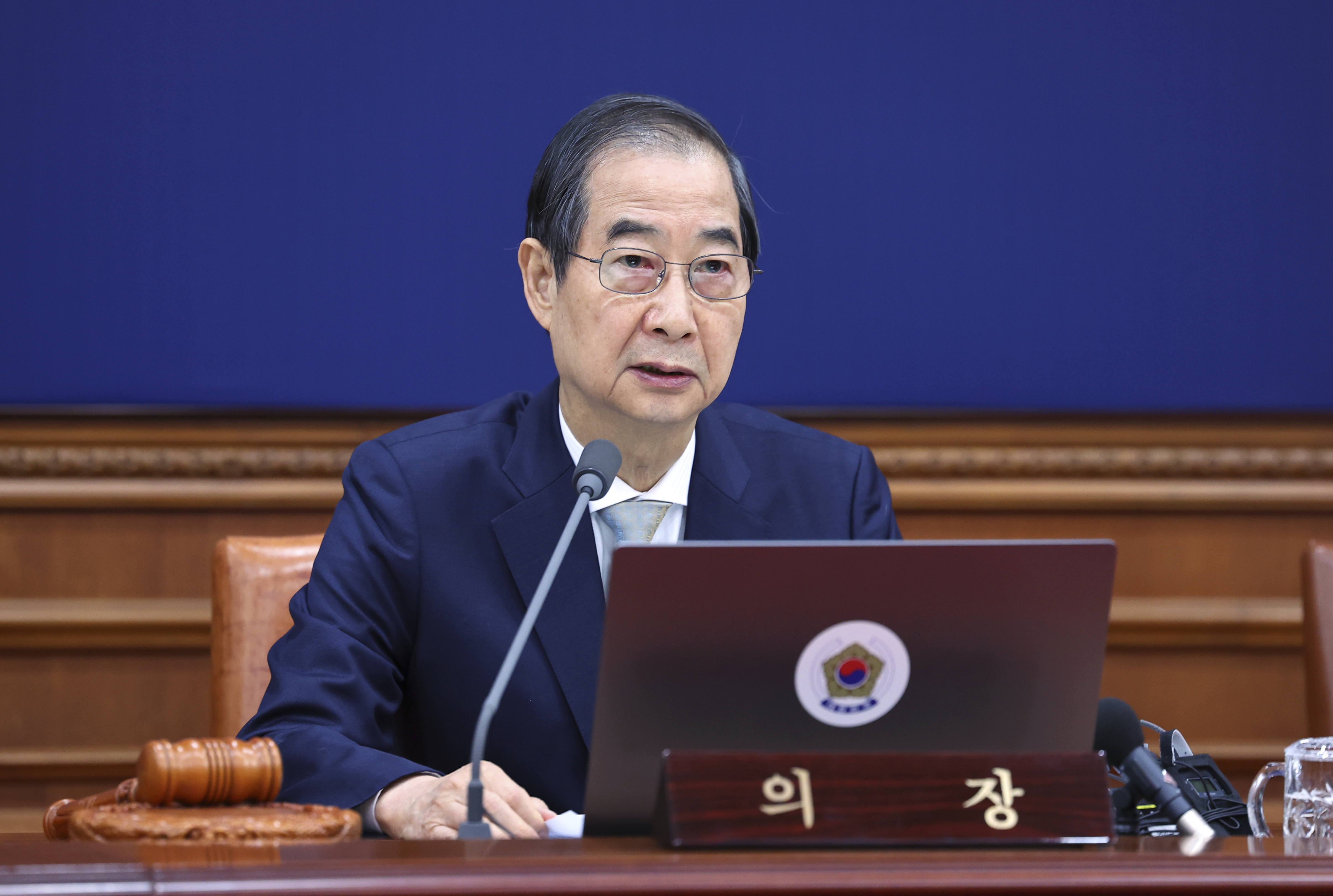 South Korea's Prime Minister Han Duck-soo, who became the country's acting leader after President Yoon Suk Yeol's impeachment, speaks during a cabinet meeting at the government complex in Seoul, South Korea, Tuesday, Dec. 24, 2024. (Yonhap via AP)