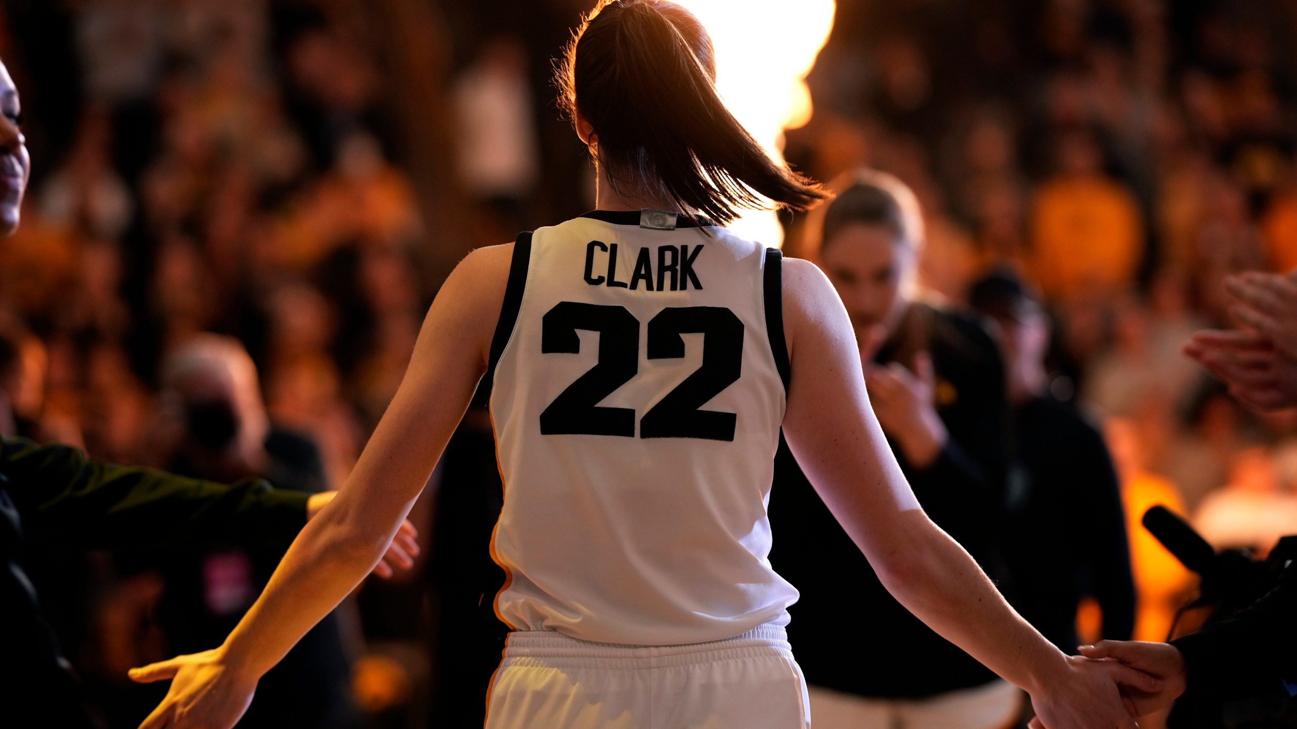 FILE - Iowa guard Caitlin Clark walks on the court during player introductions before an NCAA college basketball game against Nebraska, Saturday, Jan. 27, 2024, in Iowa City, Iowa. (AP Photo/Charlie Neibergall, File)