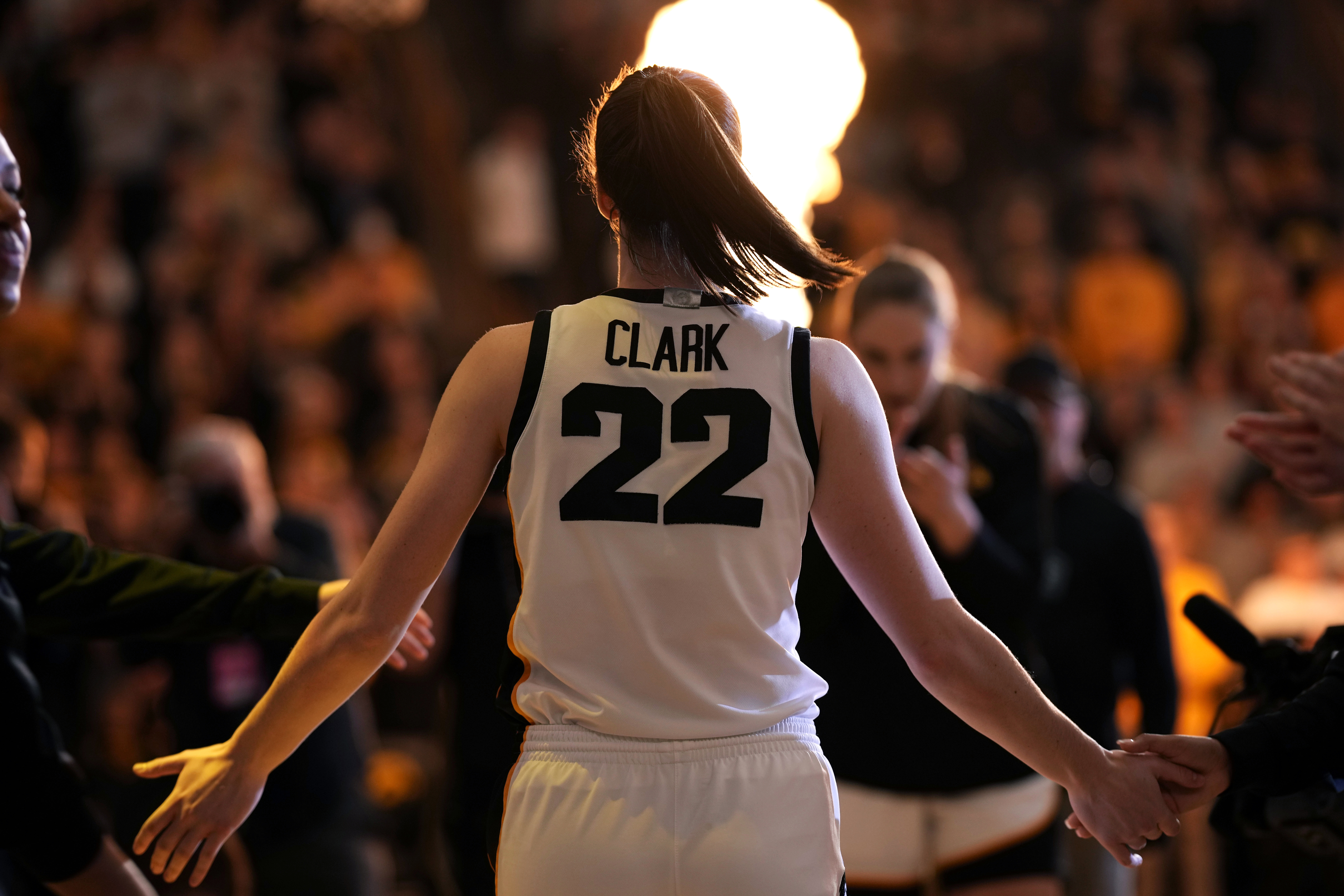 FILE - Iowa guard Caitlin Clark walks on the court during player introductions before an NCAA college basketball game against Nebraska, Saturday, Jan. 27, 2024, in Iowa City, Iowa. (AP Photo/Charlie Neibergall, File)