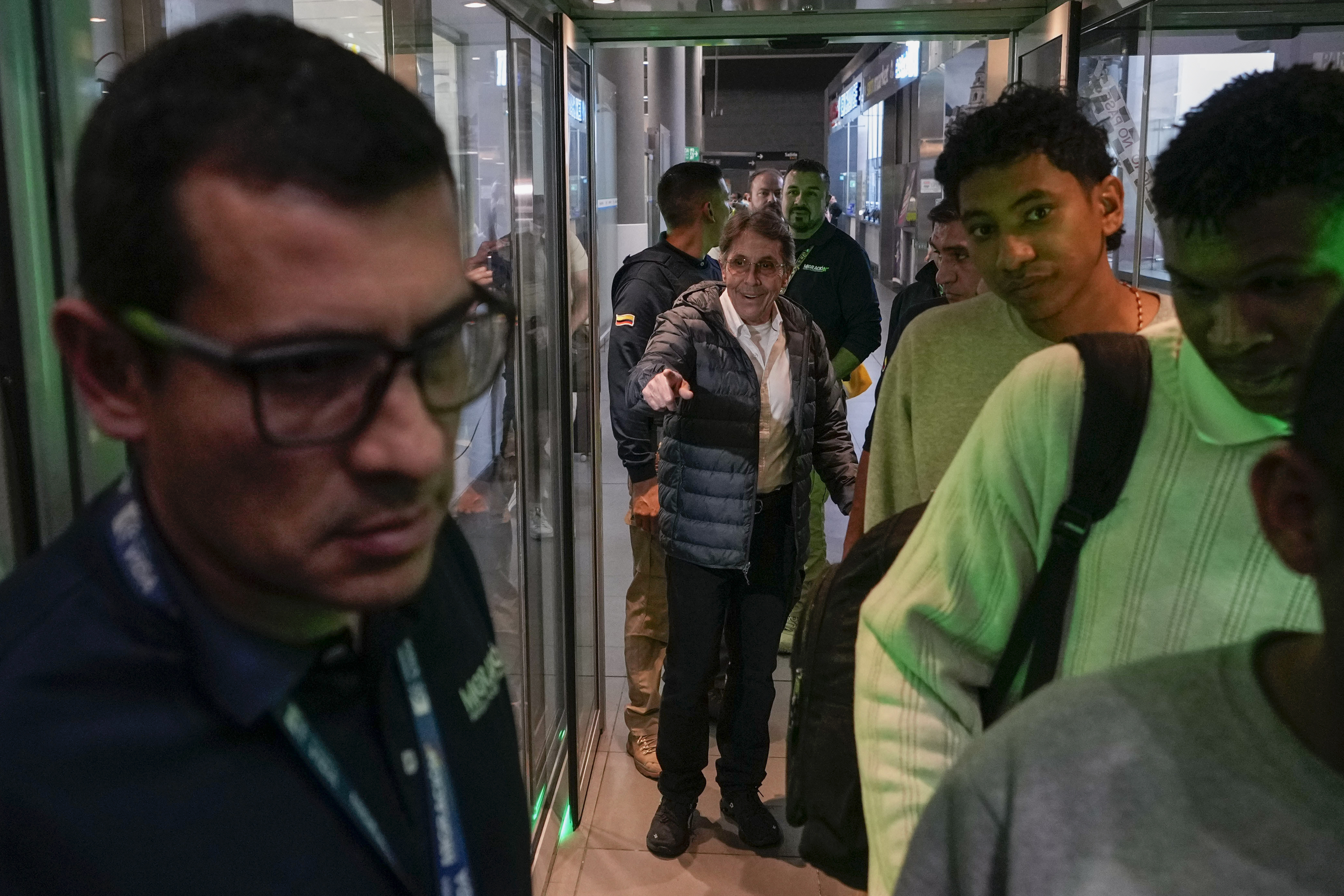 Fabio Ochoa, center, a former member of Cartel of Medellin, arrives at El Dorado airport after being deported from the U.S., in Bogota, Colombia, Monday, Dec. 23, 2024. (AP Photo/Fernando Vergara)