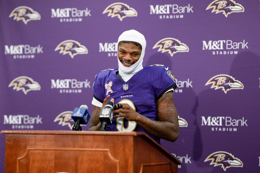 Baltimore Ravens quarterback Lamar Jackson talks to reporters following an NFL football game against the Pittsburgh Steelers, Saturday, Dec. 21, 2024, in Baltimore. The Ravens won 34-17. (AP Photo/Nick Wass)