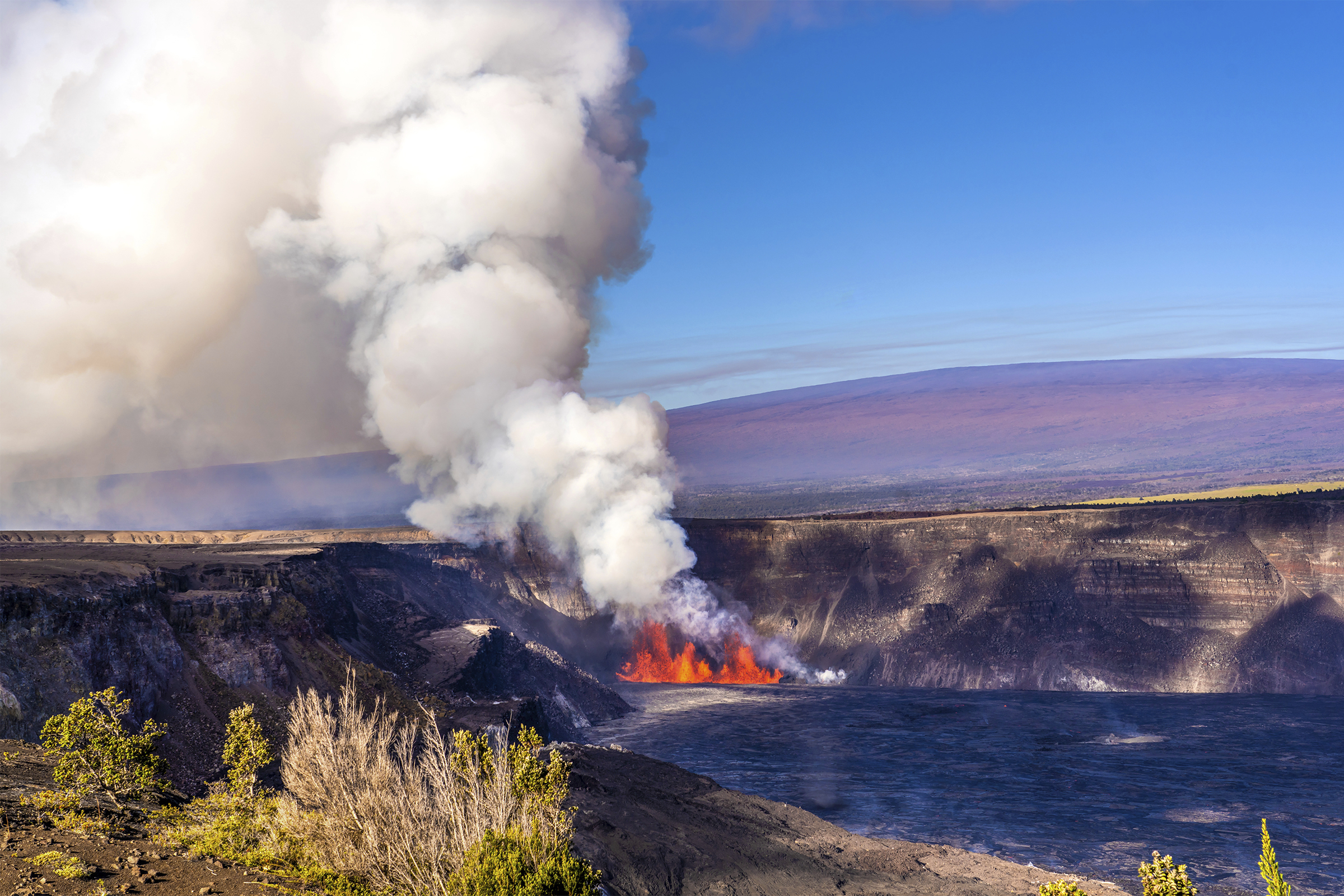 In this photo provided by the National Park Service, an eruption takes place on the summit of the Kilauea volcano in Hawaii, Monday, Dec. 23, 2024. (Janice Wei/NPS via AP)