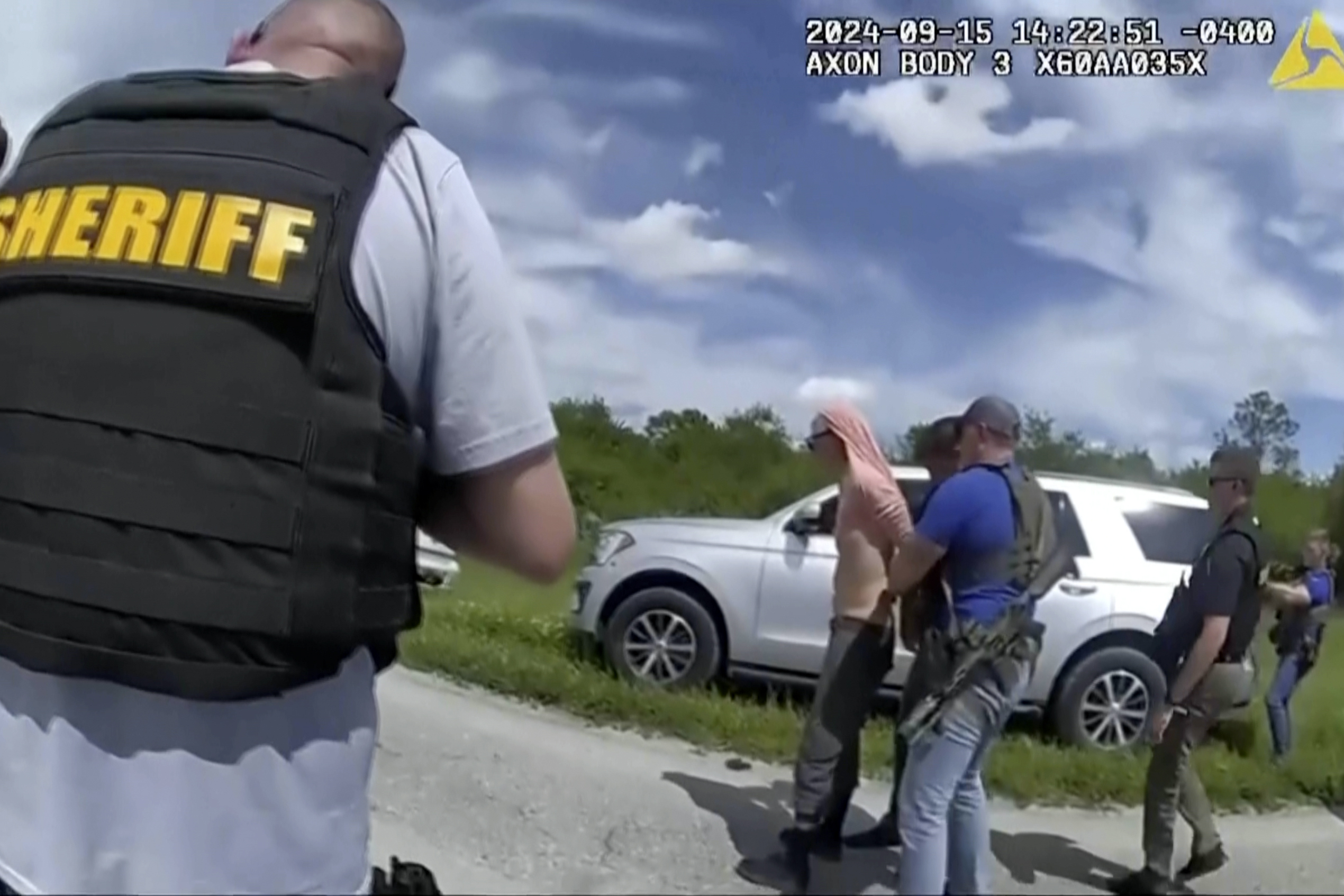 FILE - In this image taken from police body camera video and released by the Martin County, Fla., Sheriff's Office, law enforcement officers arrest Ryan Routh, the man suspected in the apparent assassination attempt of Donald Trump, Sunday, Sept. 15, 2024. (Martin County Sheriff's Office via AP, File)