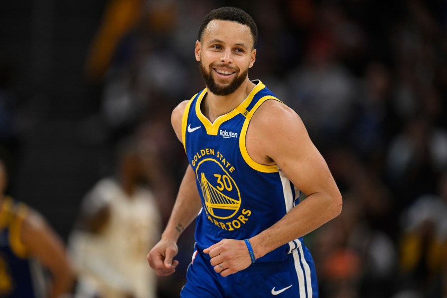 Golden State Warriors guard Stephen Curry (30) celebrates a three-point basket during the first half of an NBA basketball game against the Los Angeles Lakers, Wednesday, Dec. 25, 2024, in San Francisco. (AP Photo/Eakin Howard)