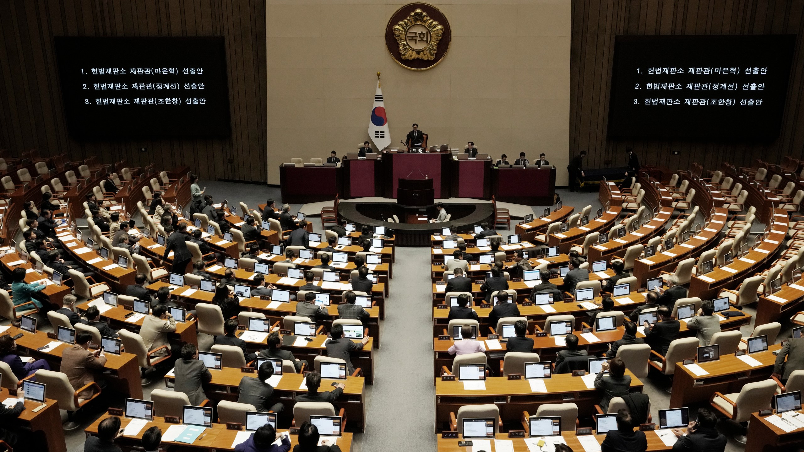 Lawmakers participate in the plenary session at the National Assembly in Seoul, South Korea, Thursday, Dec. 26, 2024. (AP Photo/Ahn Young-joon)