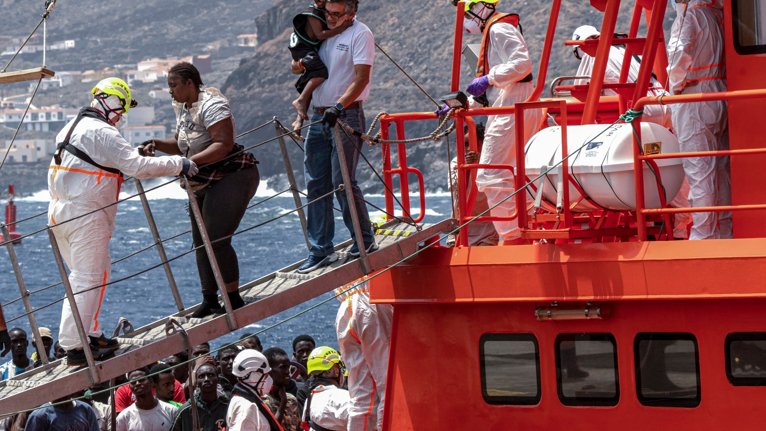 FILE - Migrants disembark at the port of "La Estaca" in Valverde at the Canary island of El Hierro, Spain, Monday, Aug. 26, 2024. (AP Photo/Maria Ximena, File)