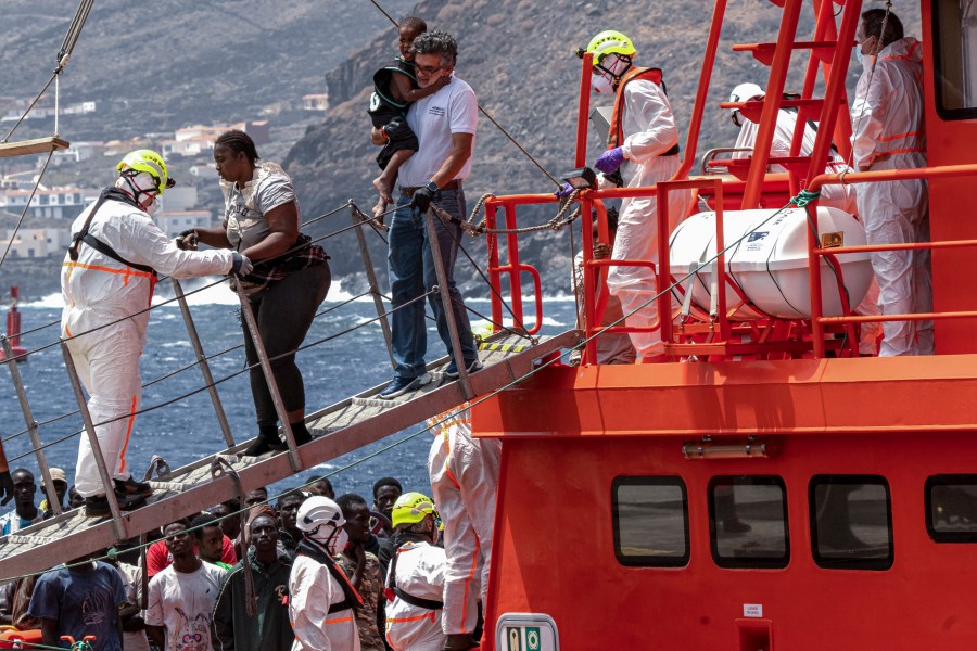 FILE - Migrants disembark at the port of "La Estaca" in Valverde at the Canary island of El Hierro, Spain, Monday, Aug. 26, 2024. (AP Photo/Maria Ximena, File)