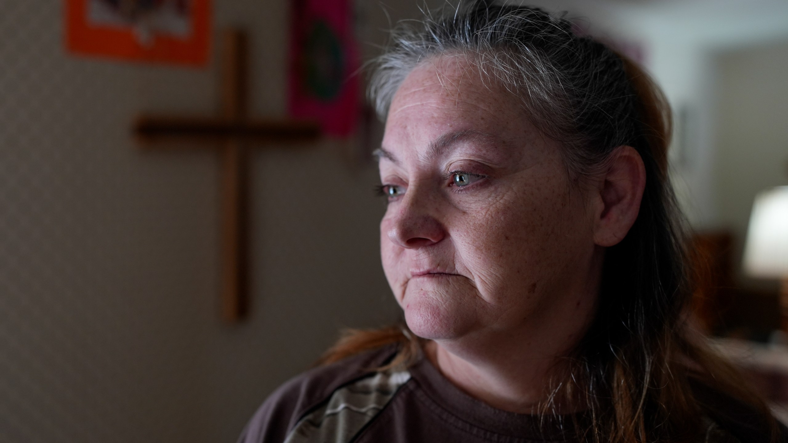 Zinnia Adkins poses for a portrait on Nov. 22, 2024, in Unicoi, Tenn. Adkins escaped flood waters caused by Hurricane Helene in September at the plastics factory where she worked. (AP Photo/George Walker IV)