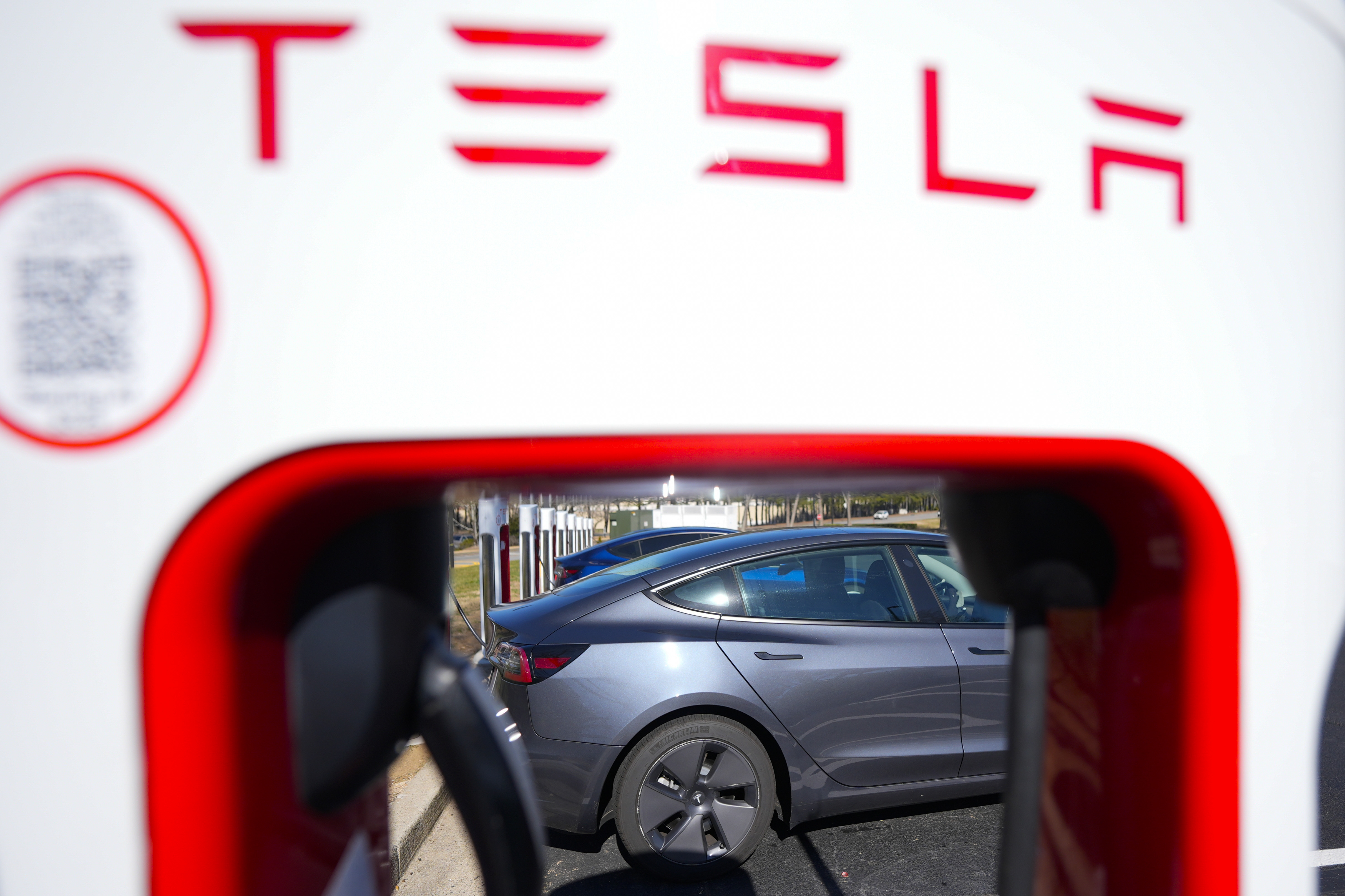 FILE - A Tesla level three Electric vehicle charger is visible, Feb. 2, 2024, in Kennesaw, Ga., near Atlanta. (AP Photo/Mike Stewart, File)