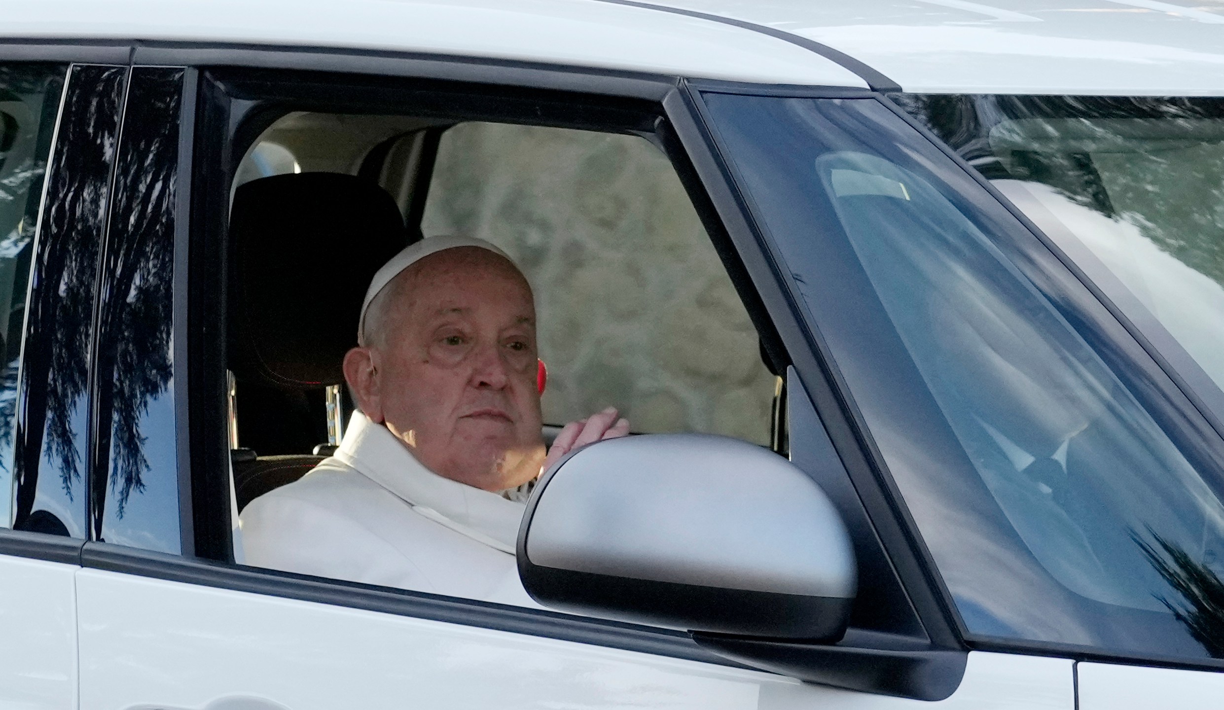 Pope Francis arrives at Rebibbia prison for the event of the opening of the Holy Door of the chapel at the prison in Rome, Thursday, Dec. 26, 2024. (AP Photo/Gregorio Borgia)