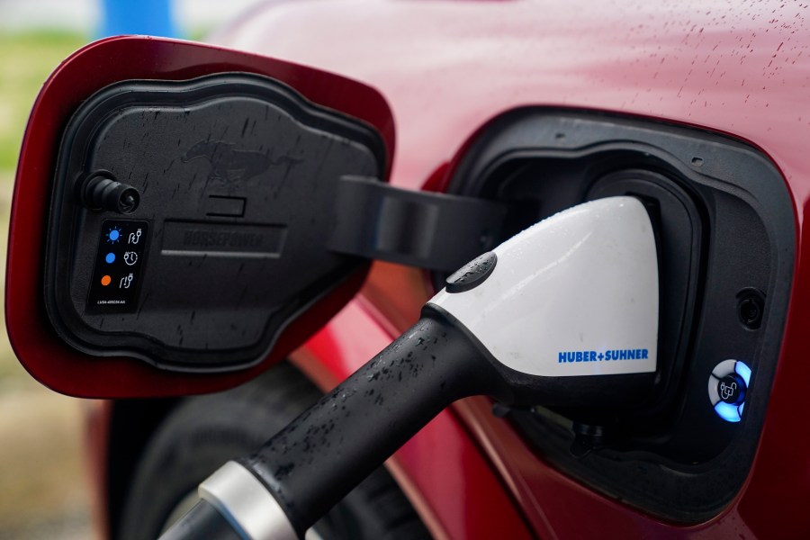 FILE - A 2023 Ford Mustang Mach-E charges, March 8, 2024, at an electric vehicle charging station in London, Ohio. (AP Photo/Joshua A. Bickel, File)