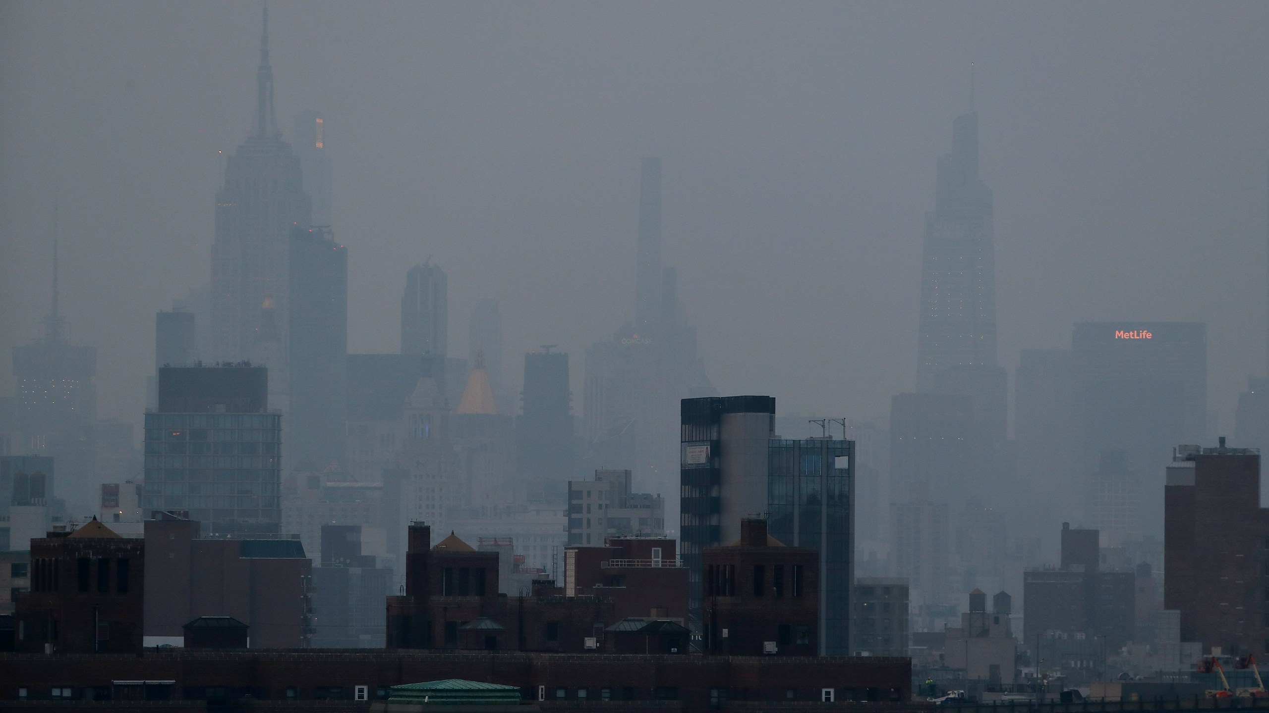 FILE - A thick haze hangs over Manhattan in New York on July 20, 2021. (AP Photo/Julie Jacobson, File)