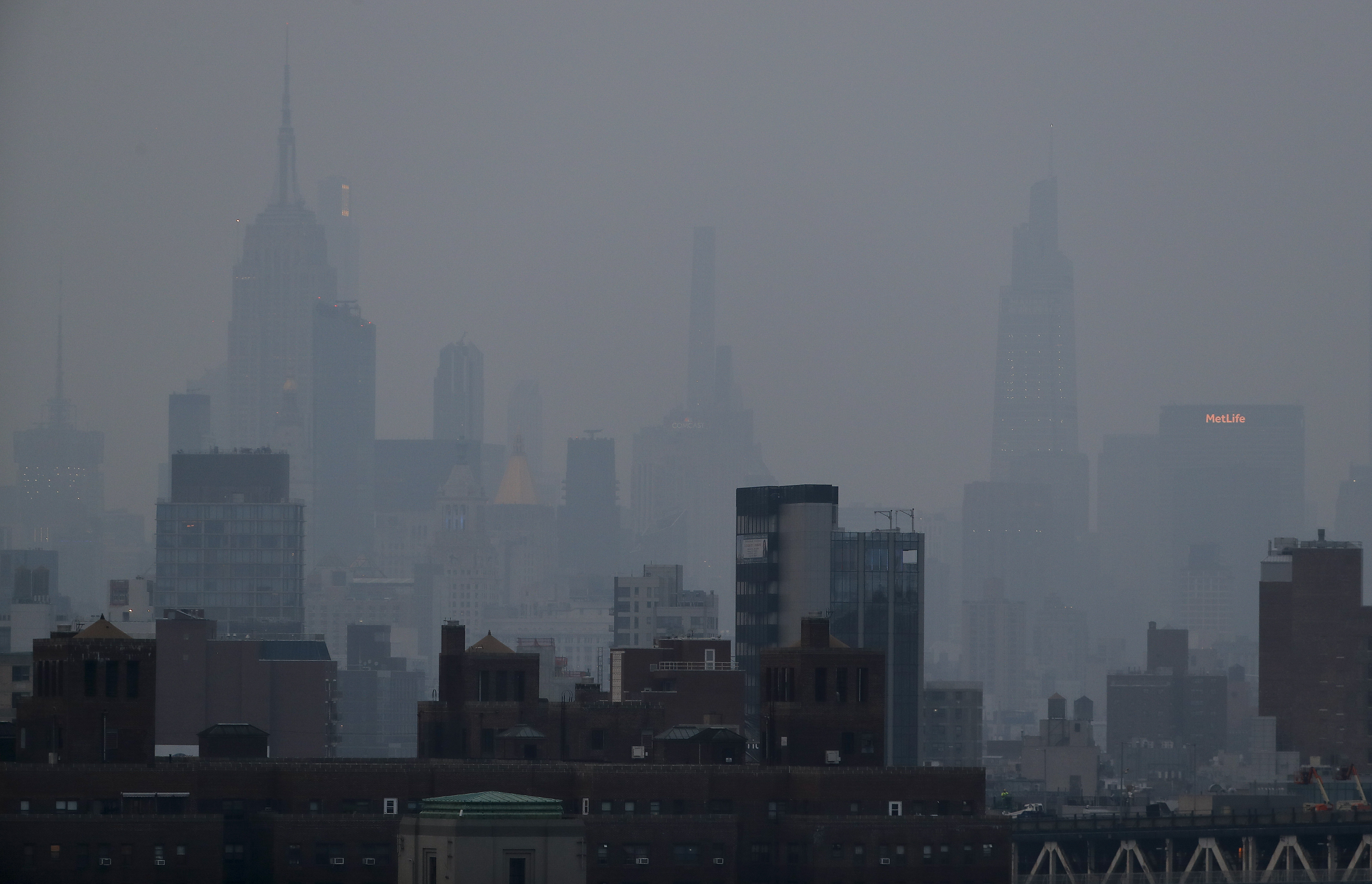 FILE - A thick haze hangs over Manhattan in New York on July 20, 2021. (AP Photo/Julie Jacobson, File)