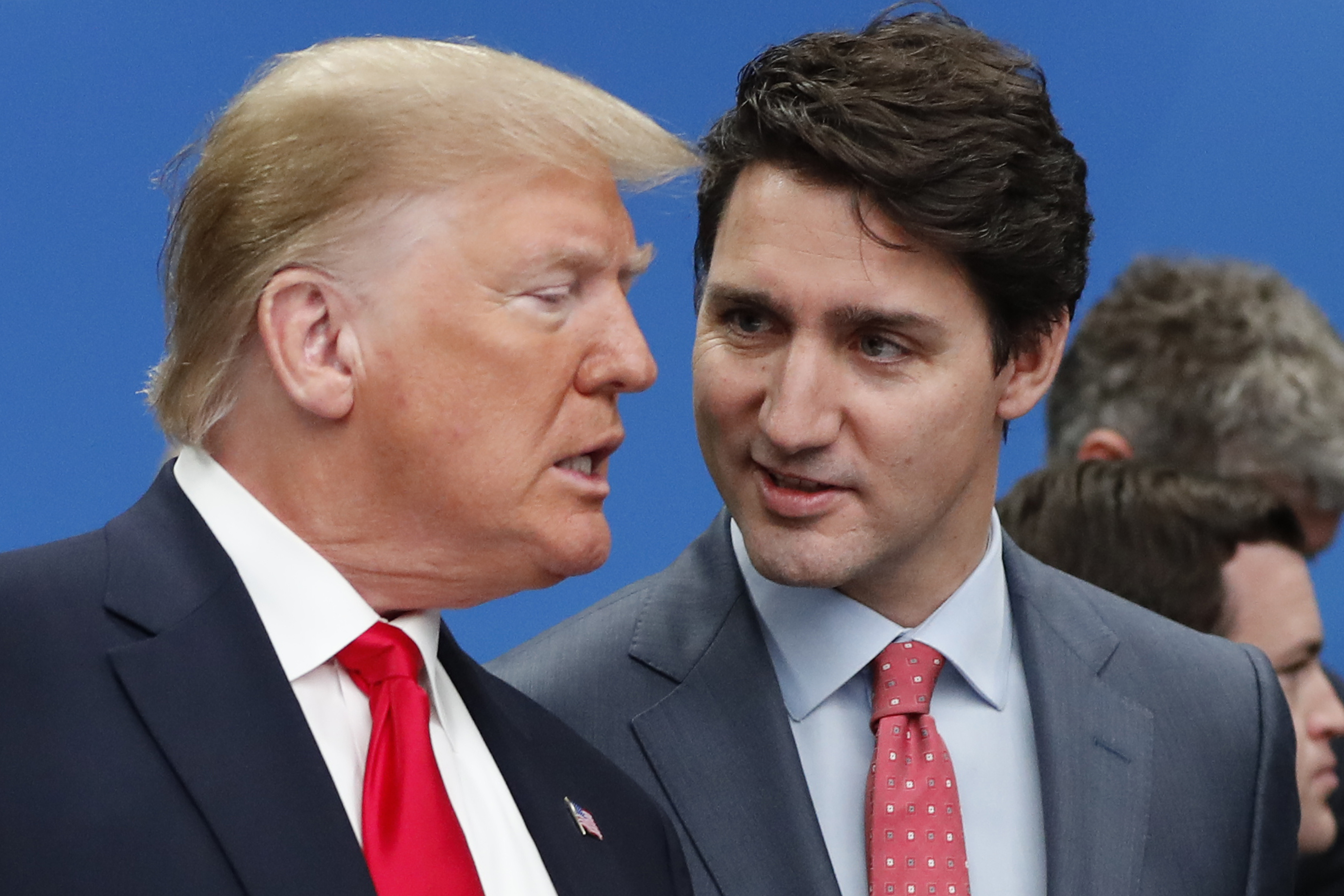 FILE - U.S. President Donald Trump, left, and Canadian Prime Minister Justin Trudeau talk prior to a NATO round table meeting at The Grove hotel and resort in Watford, Hertfordshire, England, Dec. 4, 2019. (AP Photo/Frank Augstein, File)