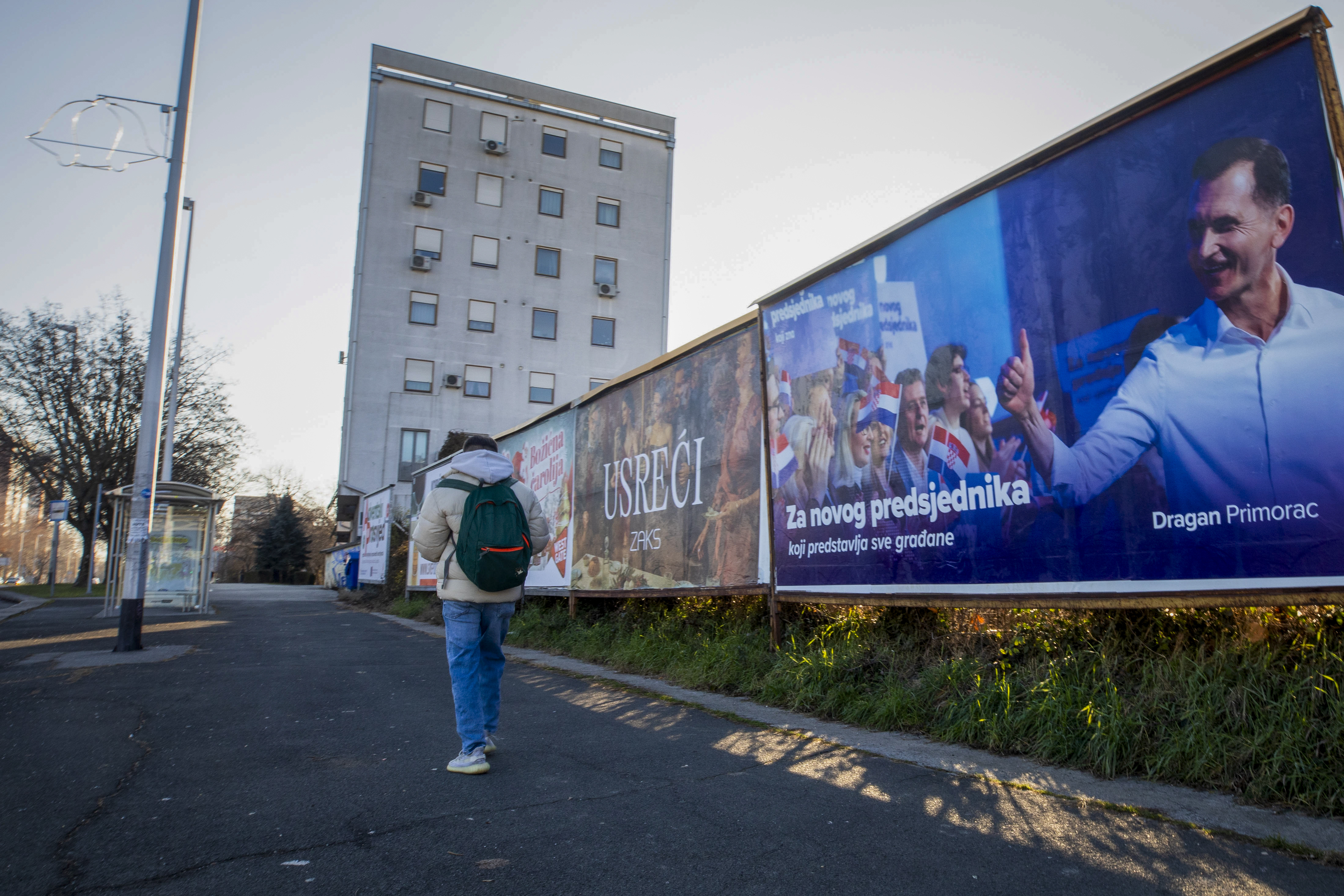 A campaign poster of residential candidate Dragan Primorac hangs ahead of the presidential election in Zagreb, Croatia, Thursday, Dec. 26, 2024. (AP Photo)